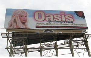 Currently an advertisement for the Oasis Gentlemen’s Club located at 6800 Essington Ave. is displayed on the billboard facing drivers along the Schuylkill Expressway. | Connor Showalter, Philadelphia 