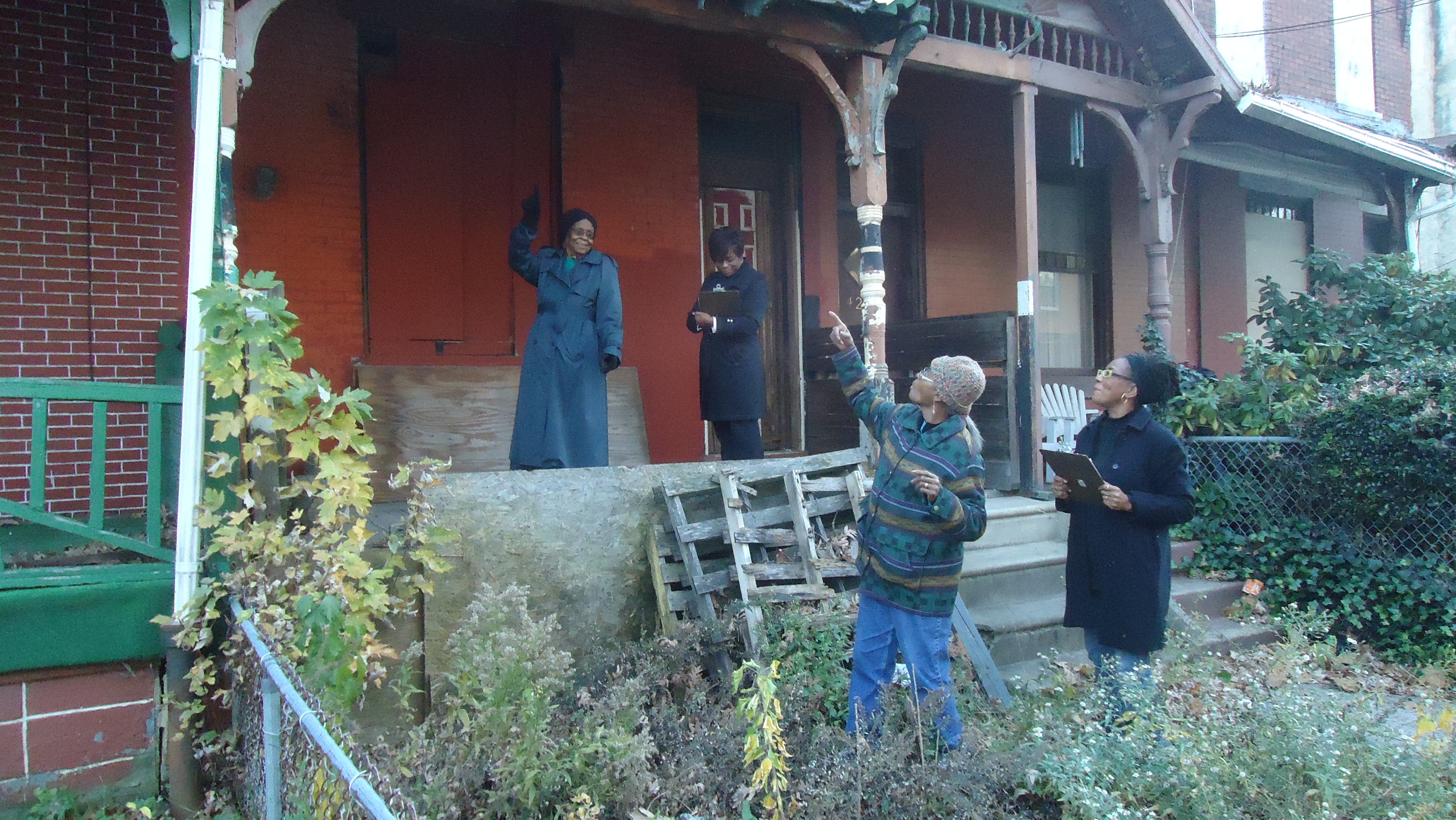 Members of the Viola Street Residents Association conducting an inventory of vacant property on their street.