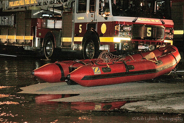 After a water main broke at 21st and Bainbridge Sunday night, the Fire Department helped evacuate residents via boat. | Rob Lybeck, Eyes on the Street Flickr group