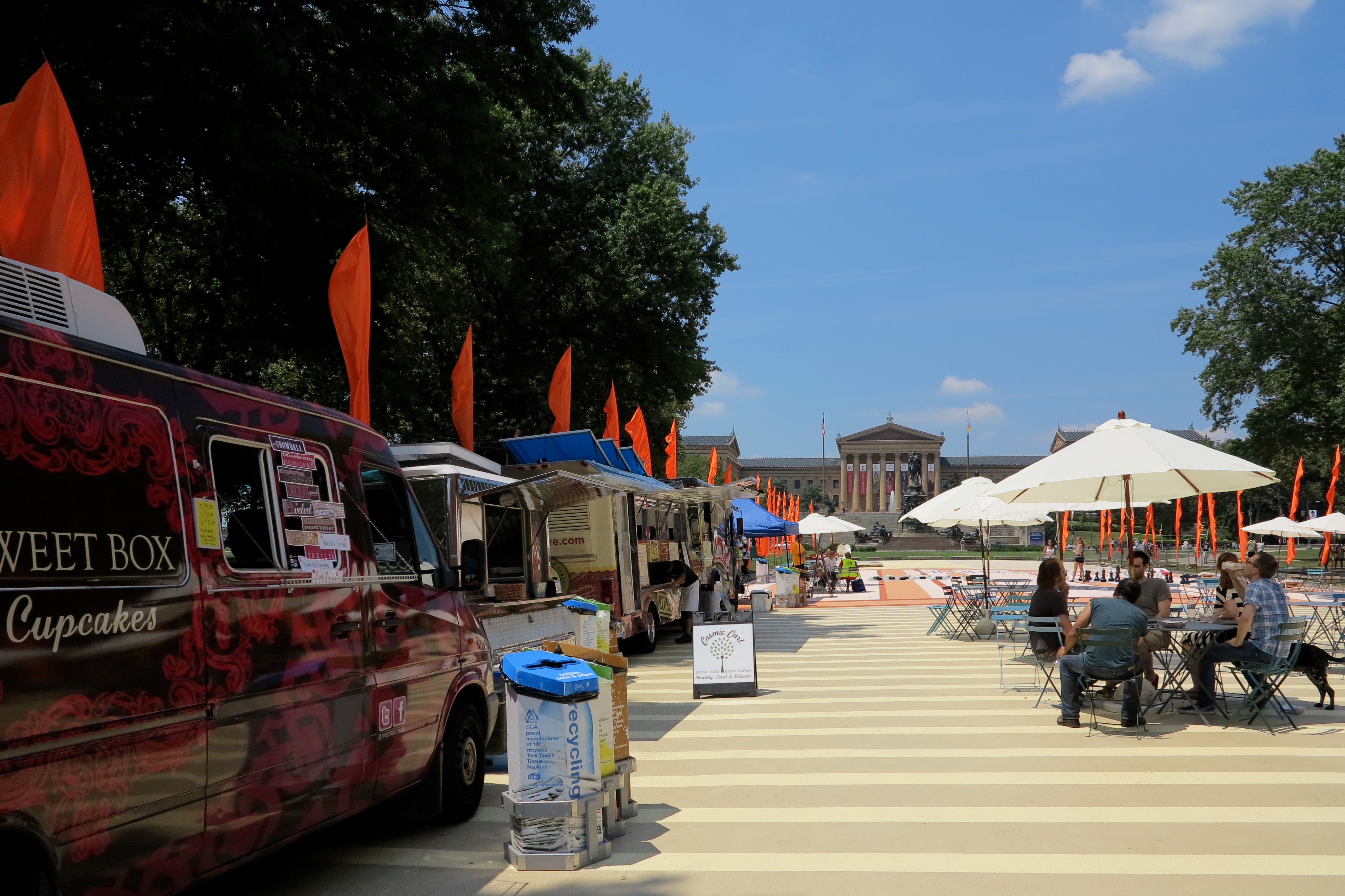 A revolving cast of food trucks line the boardwalk