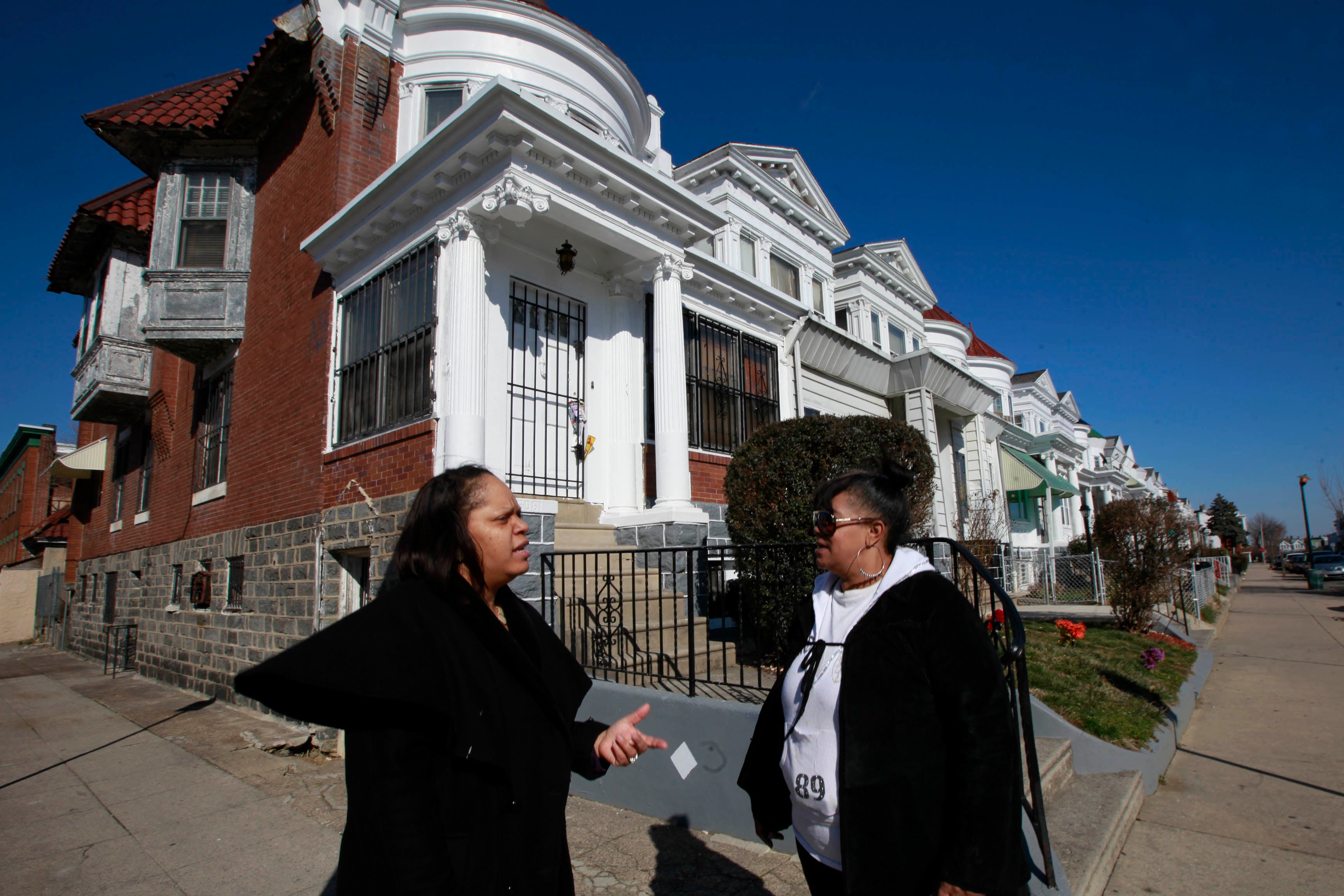 Block Captain Denise Lewis (left) and Co-Captain Lisa Jones stand at the corner of 61st and Webster.