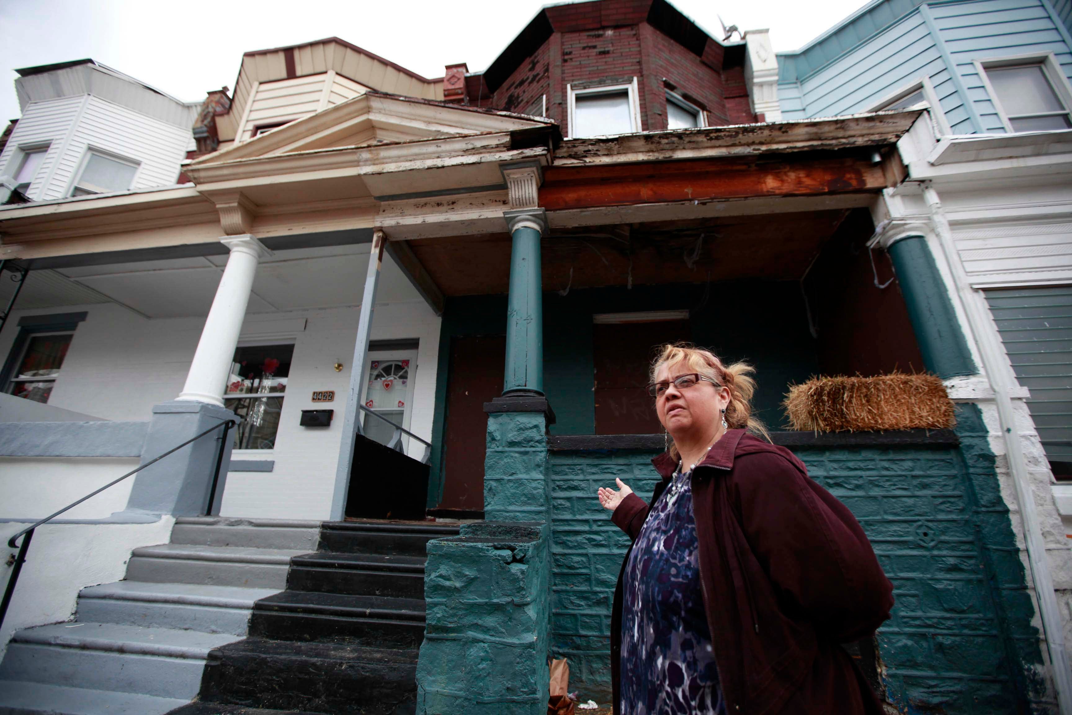 Block captain Luisa Baerga stands in front of 4424 North Orianna Street February 28, 2013. ( David Swanson / Inquirer Staff Photographer )