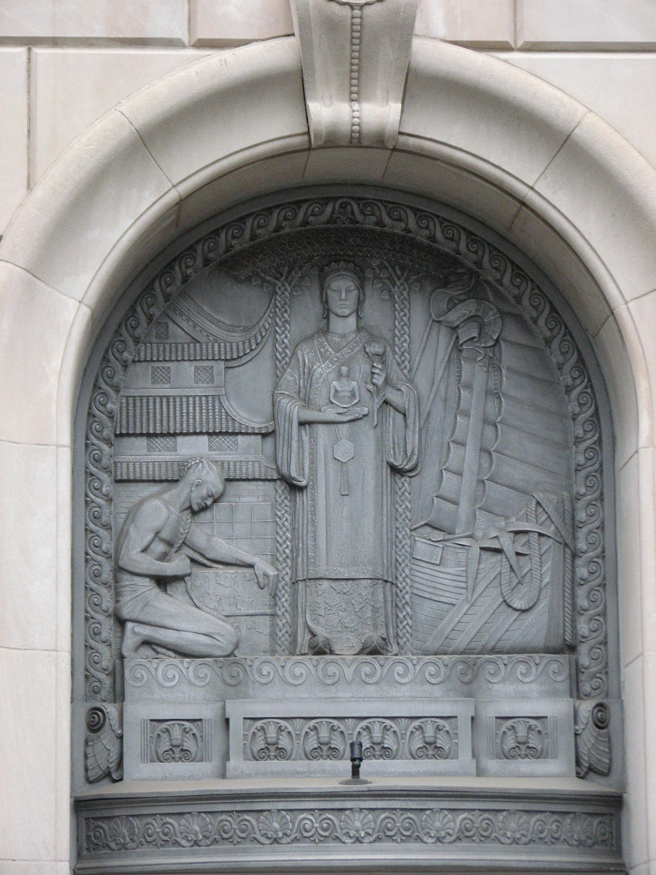 Beautiful Deco designs emerge in metal above each entrance.