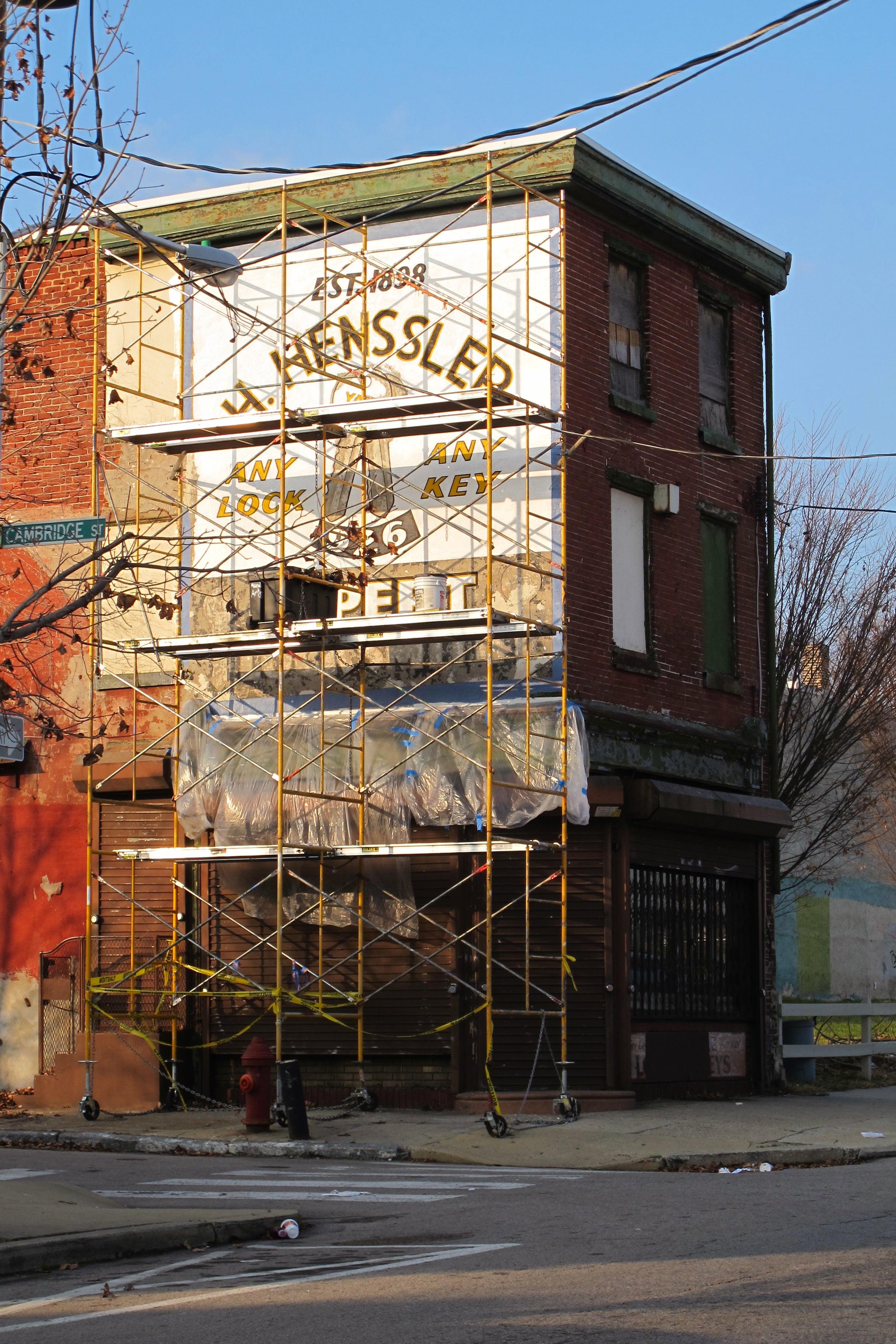 H. Henssler's sign being restored, December 2012