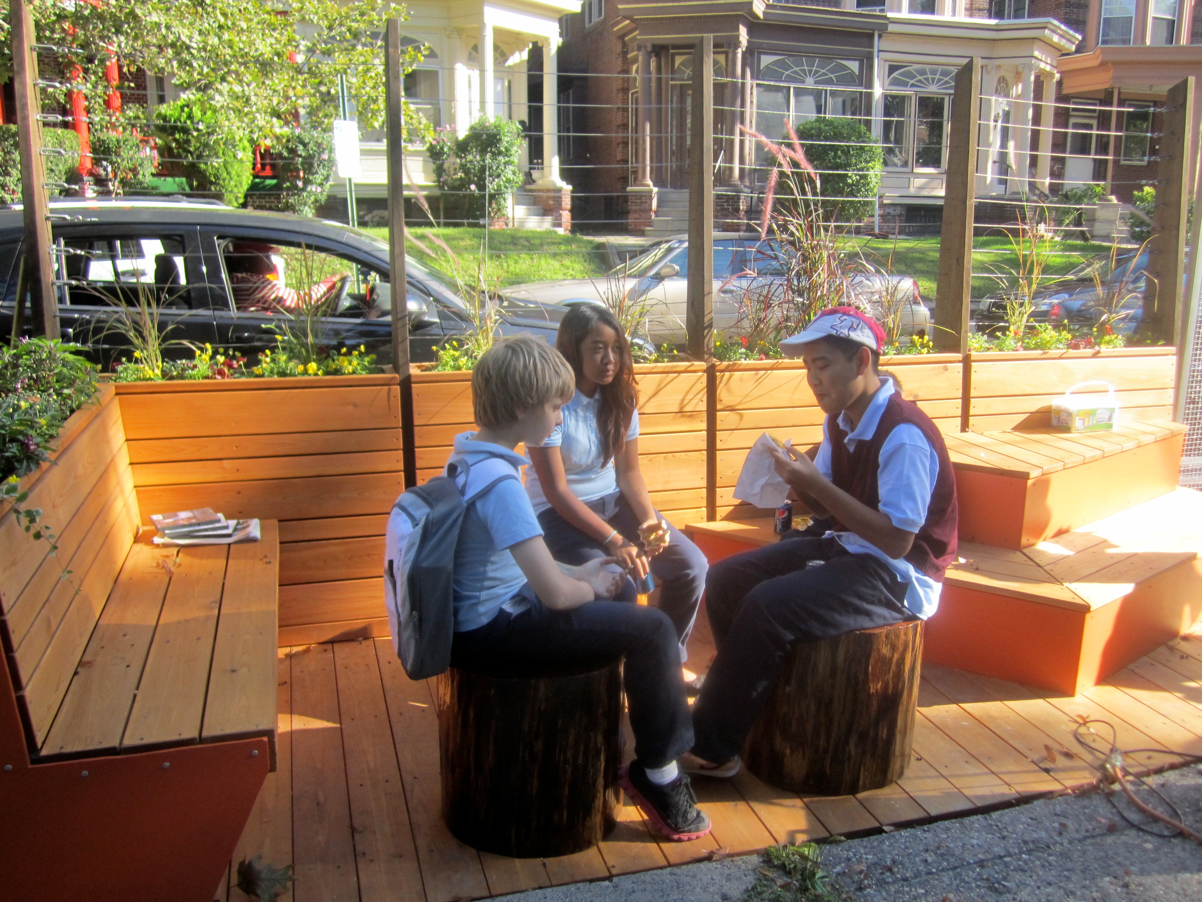 Students from nearby Logan Hope School sat on the log stools that were brought in from West Grove, Pa.