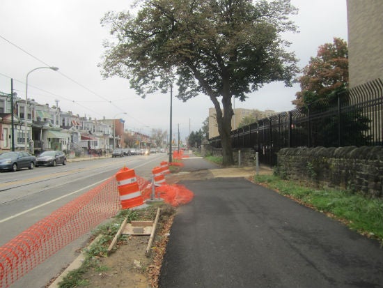 Some of the new pavement is in place, but much of the topsoil and landscaping work remains