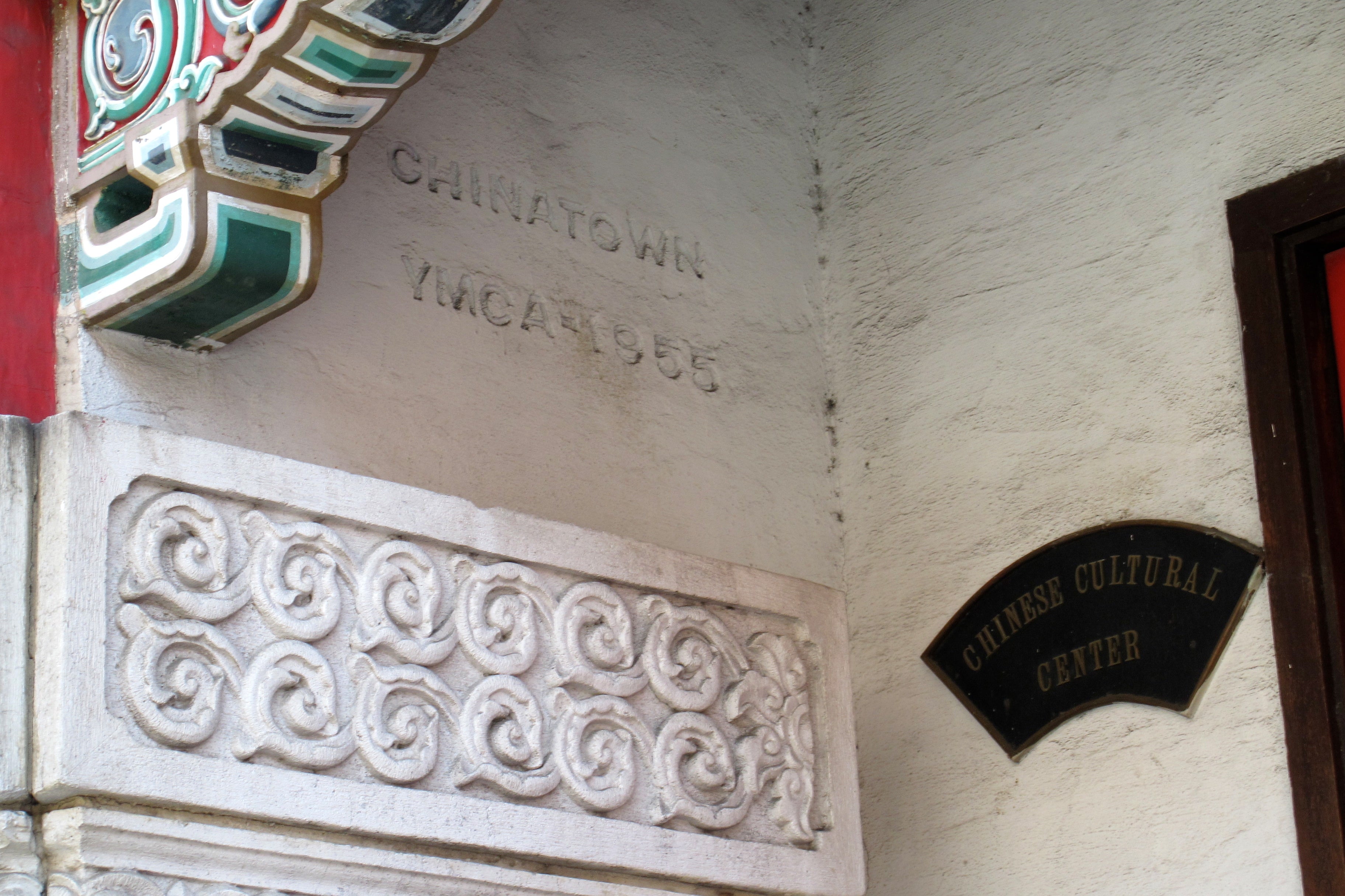 Markers in the recessed entryway for the Chinatown YMCA and the Chinese Cultural Center