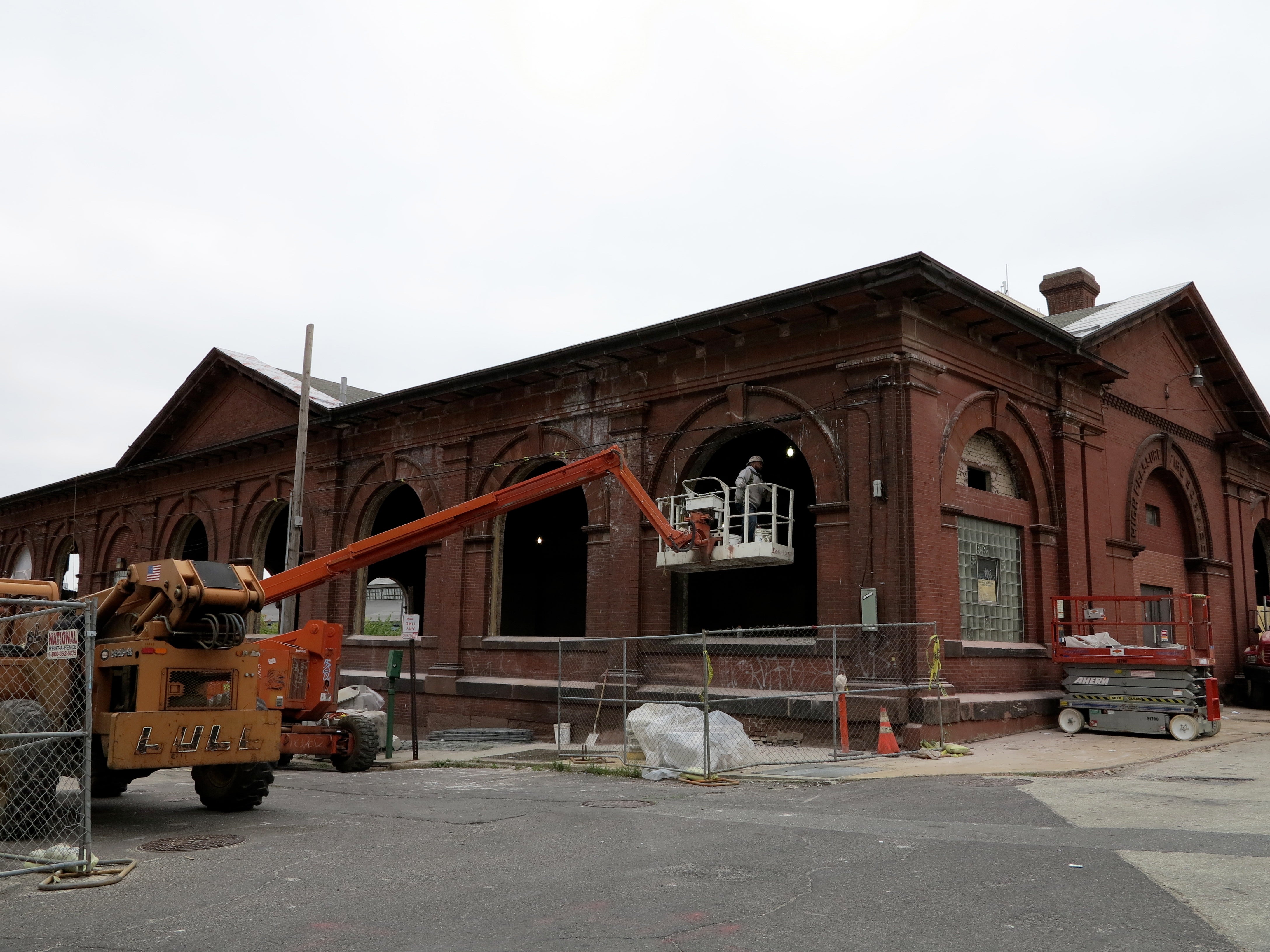 On the rear facade, you can see the bricked and glass-blocked openings of the past.