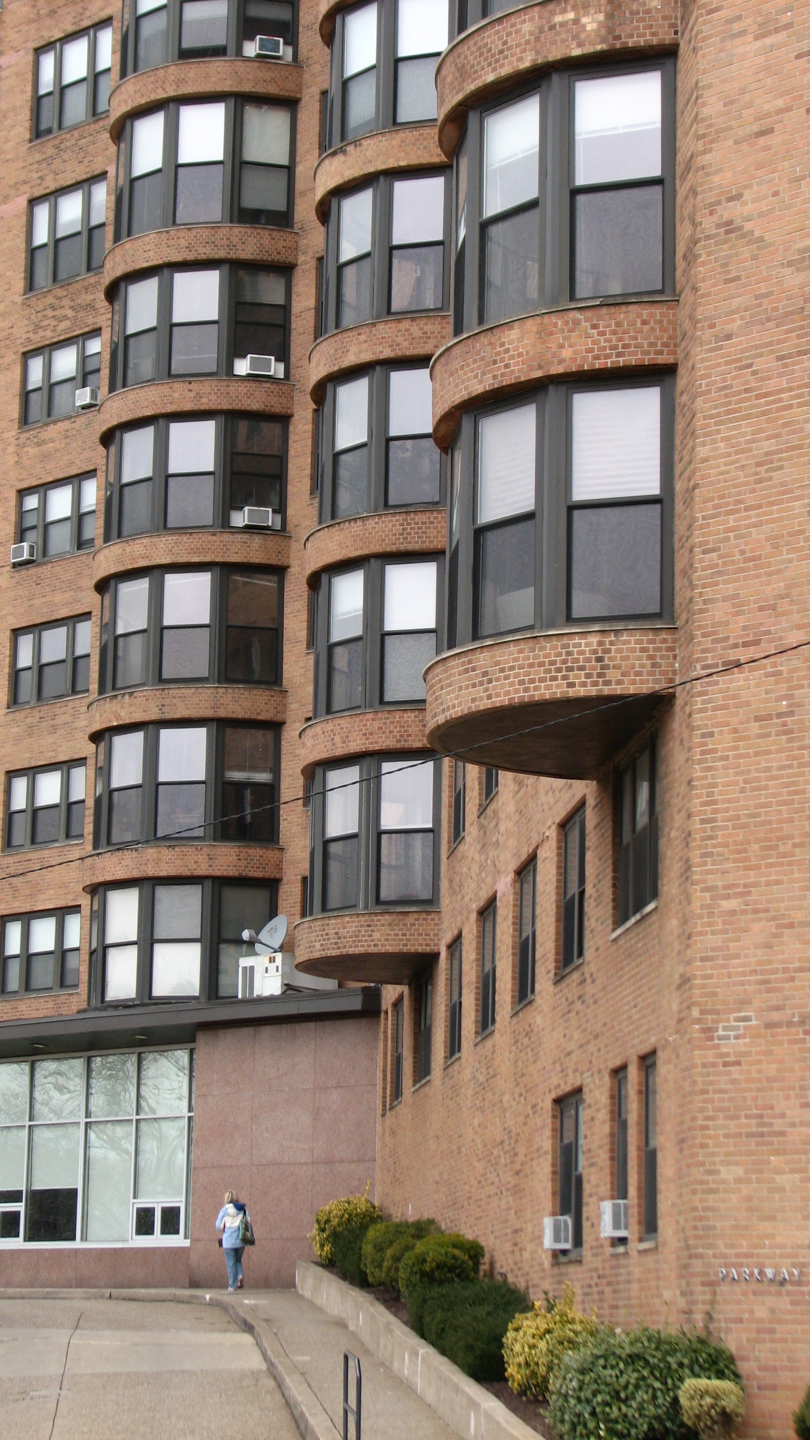 Round bays form verticle columns on the front of the building.