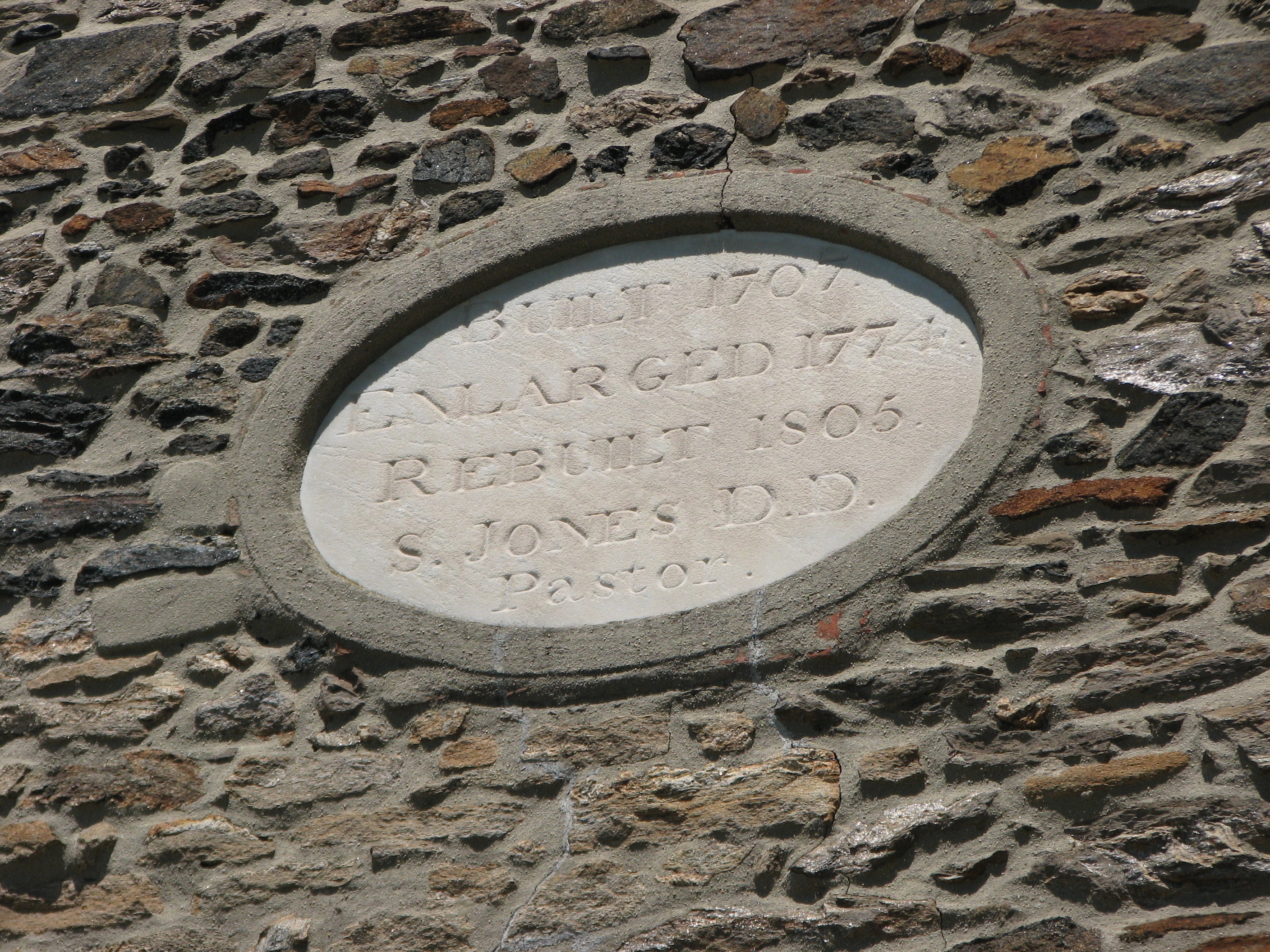 The carved stone in the building pediment provides a brief history of the church.
	
		 
 