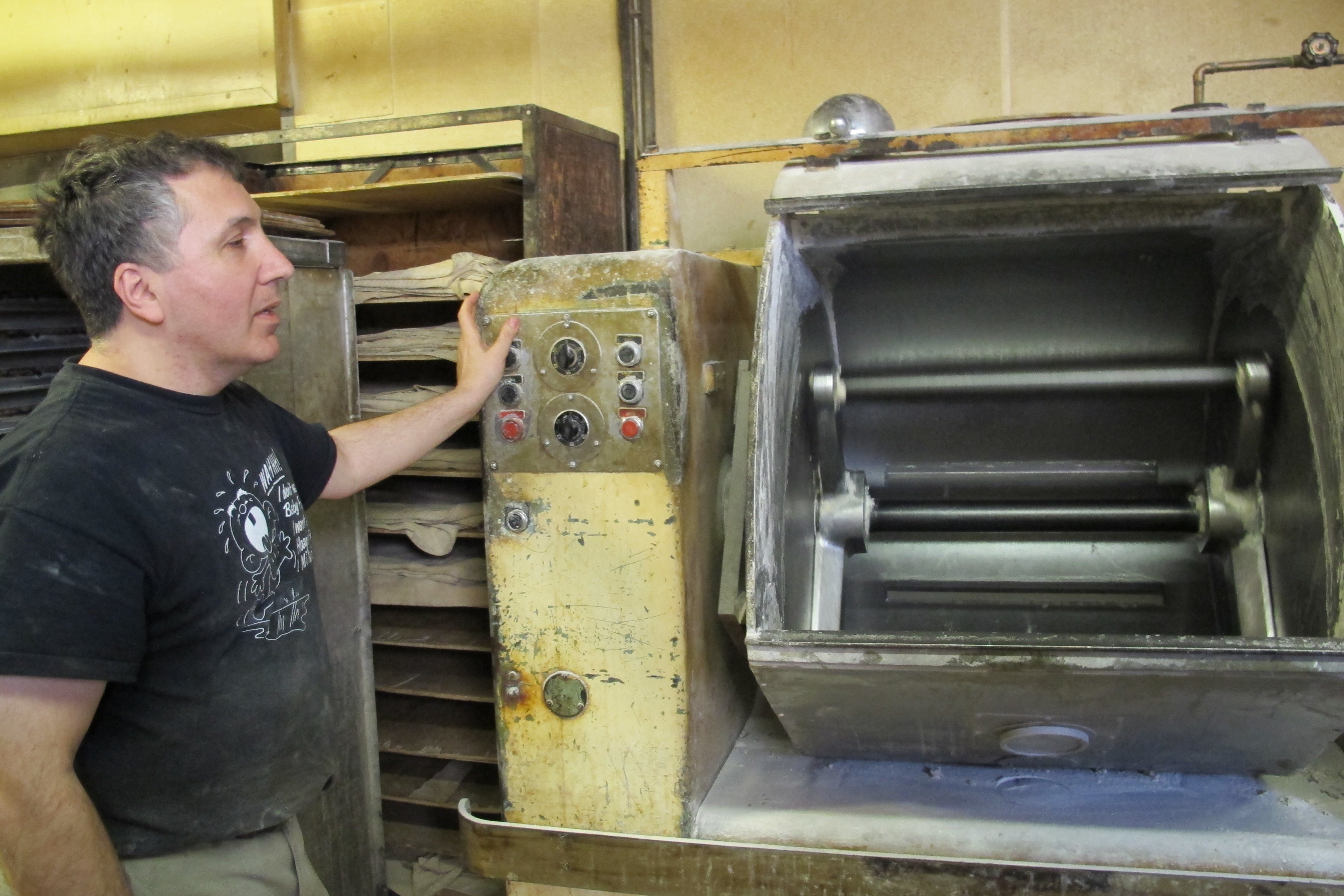 Stephen Candeloro showing off some of his shop's vintage, but still used, equipment.