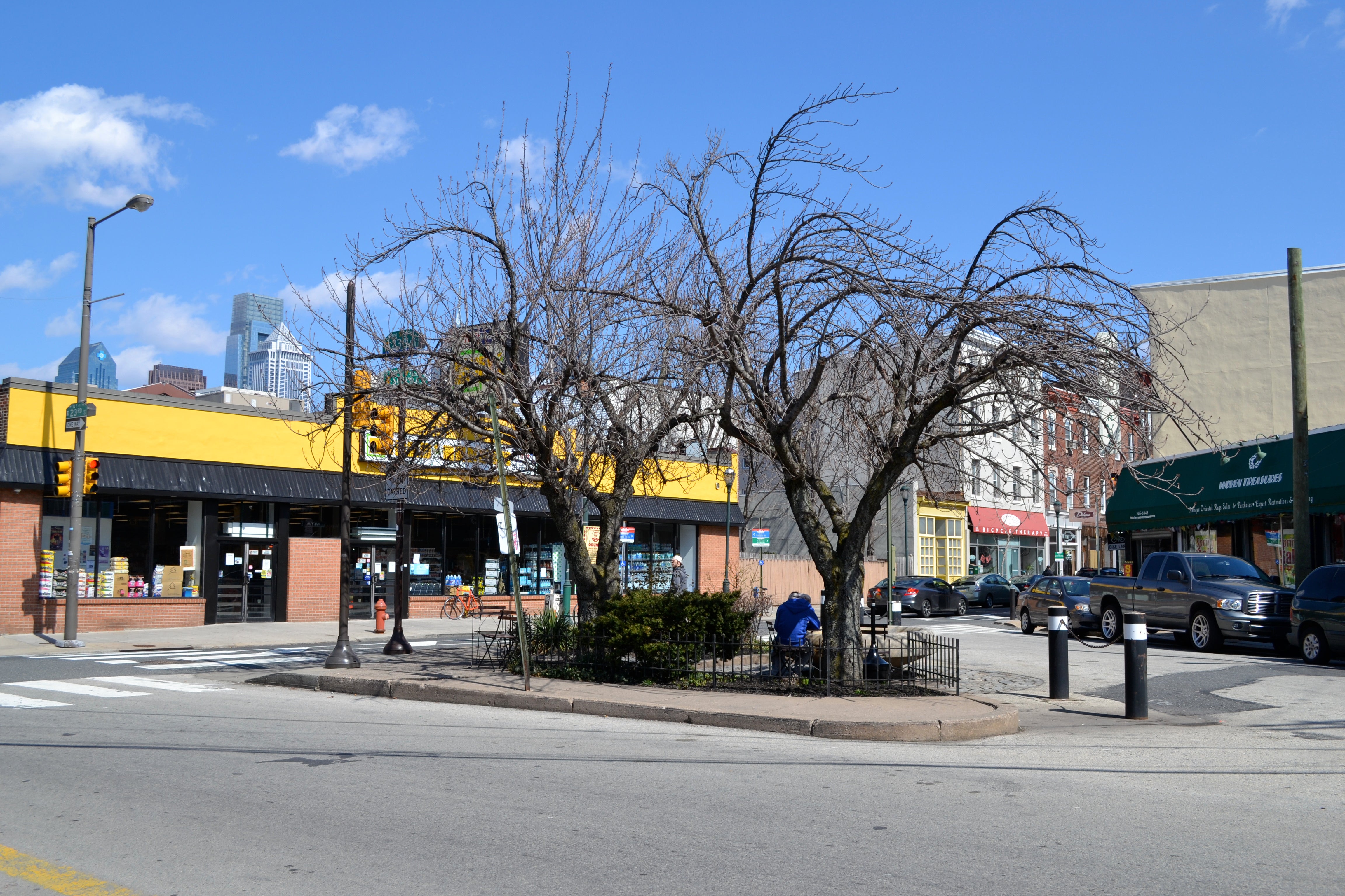 The northern triangle at Grays Ferry Ave and South Street has greenery, seating and a now active fountain