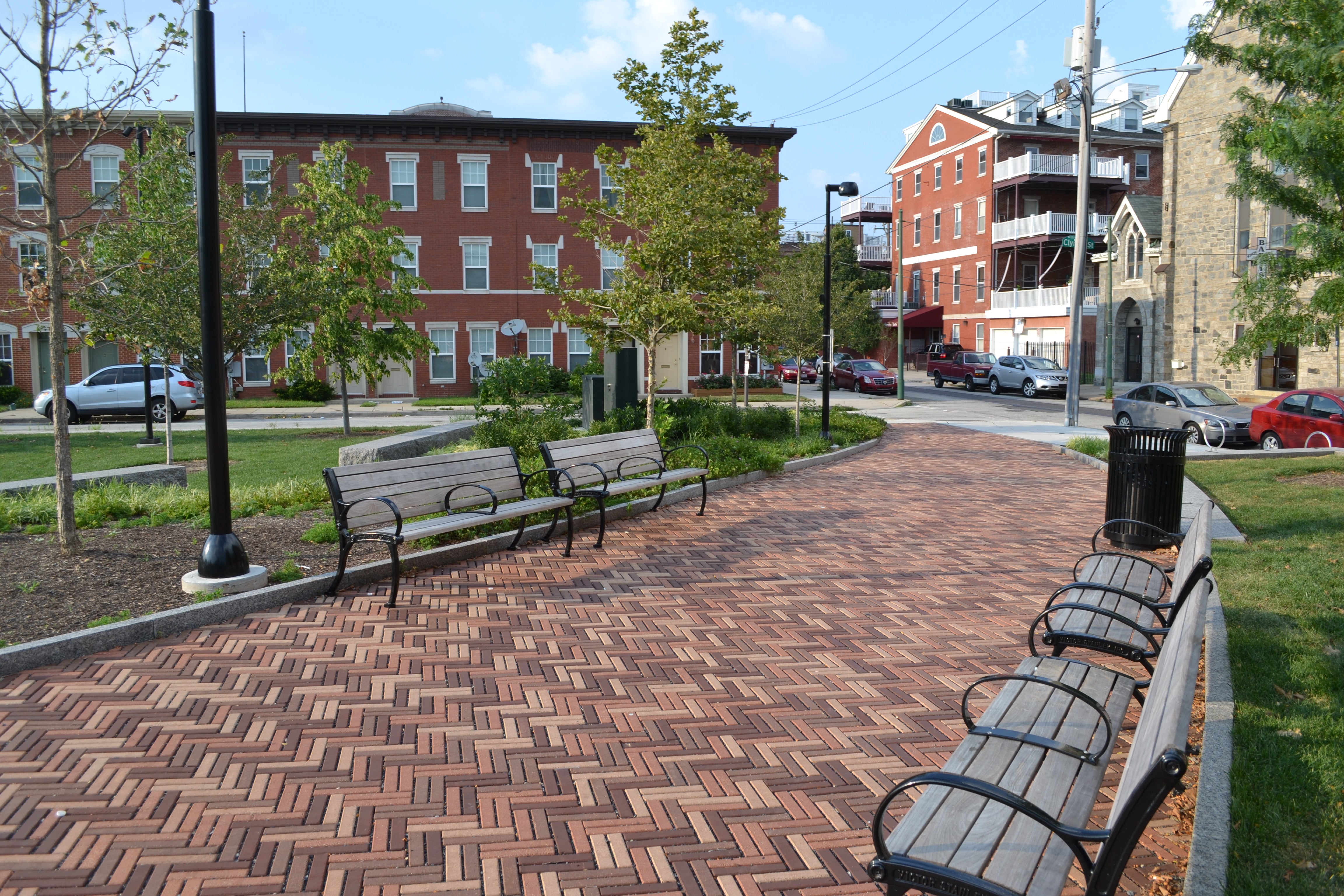 The zig-zagged brick pattern catches your eye as you enter the park through one of many access points