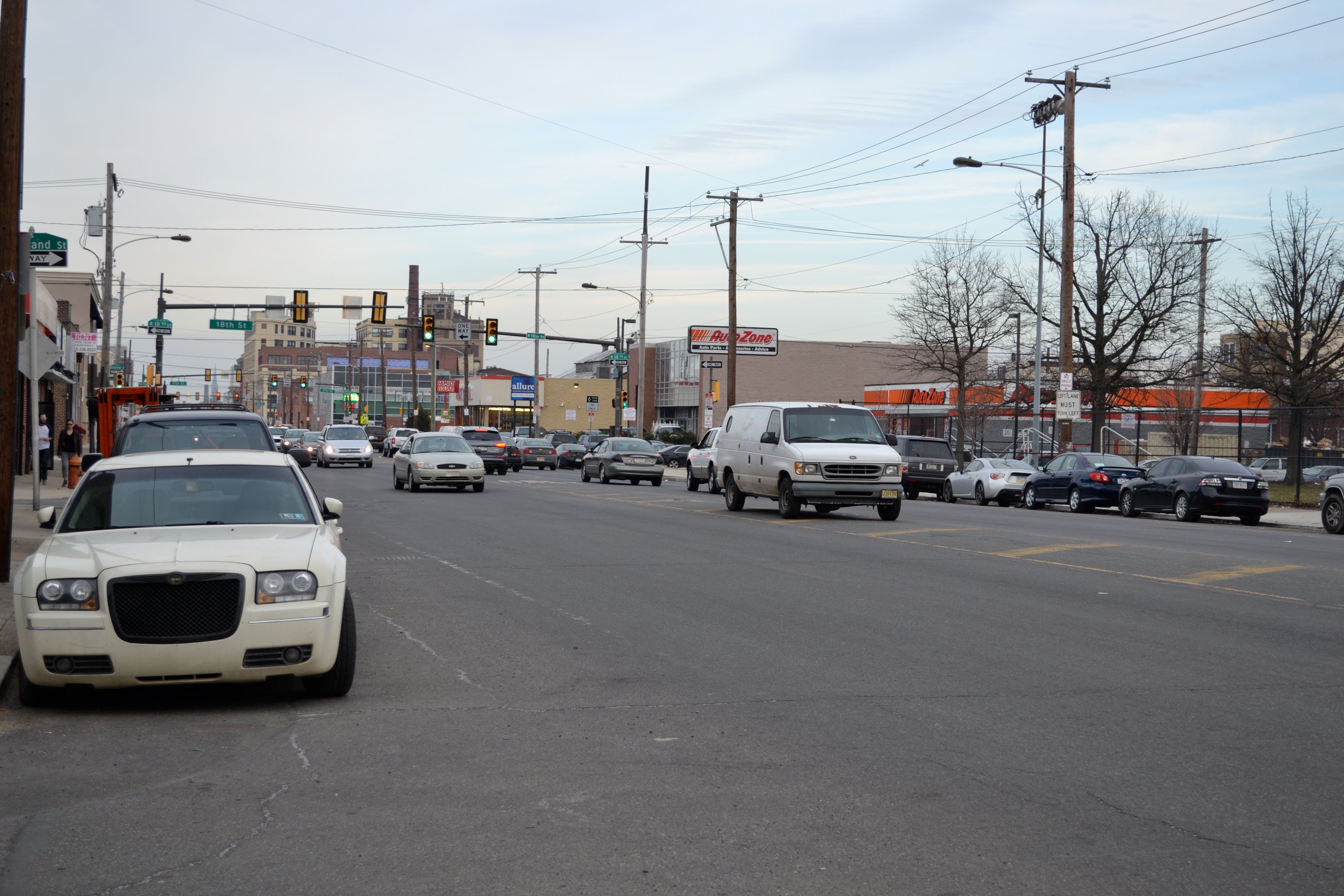 A lone van parks in a turning lane