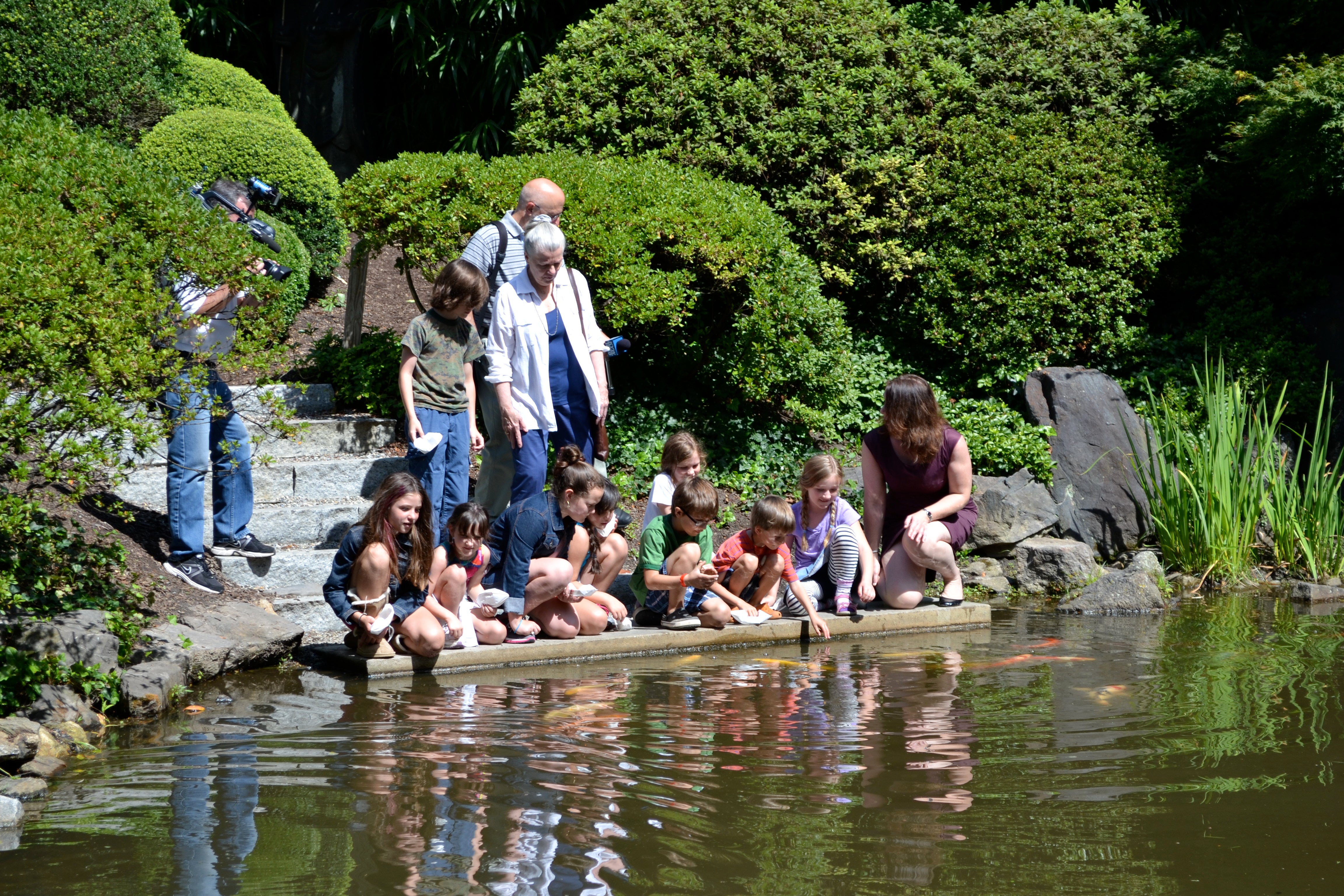 Campers fed koi fish from the restored boat launch and new granite steps