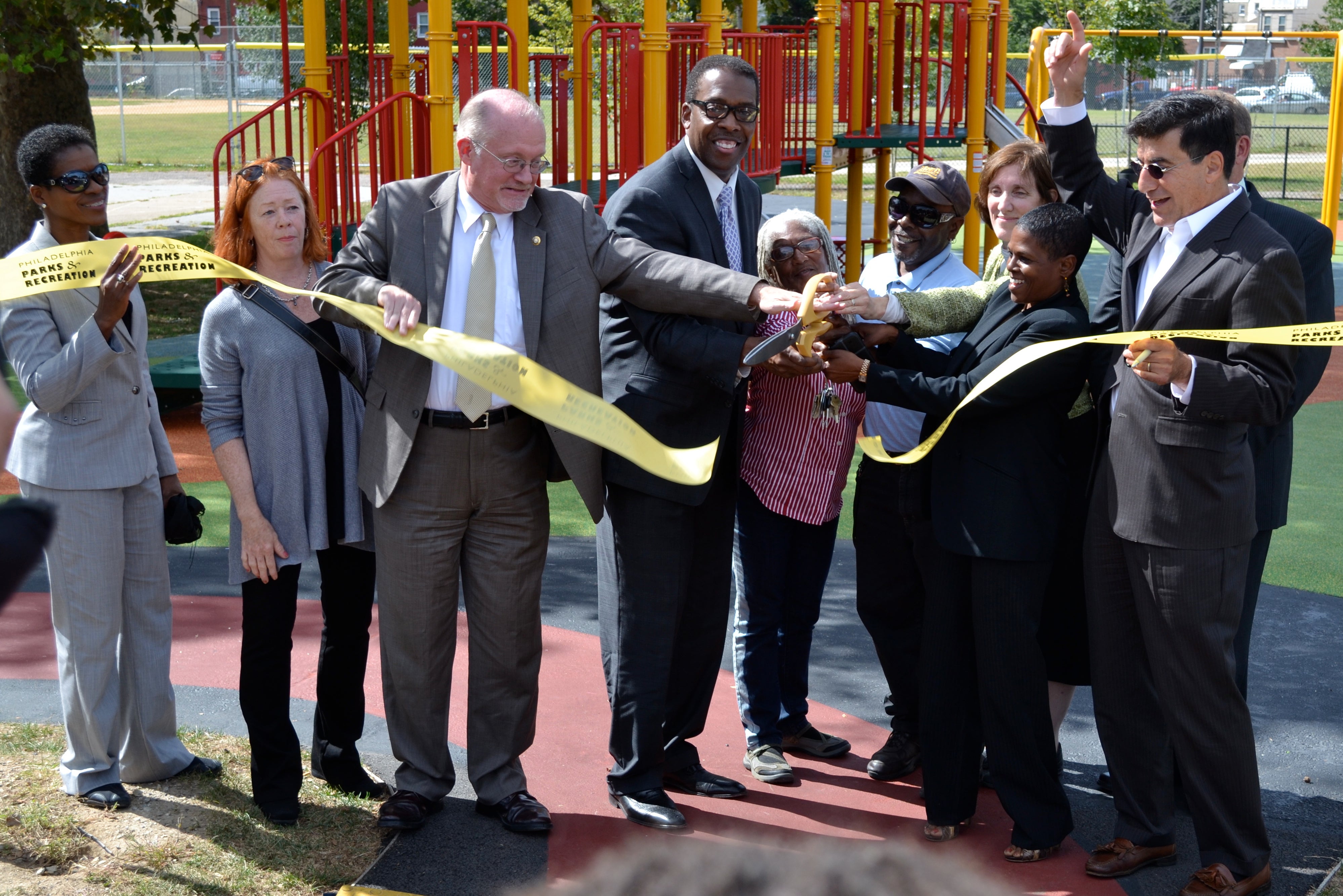 City officials and those involved in the park and community cut the ribbon, officially debuting the project