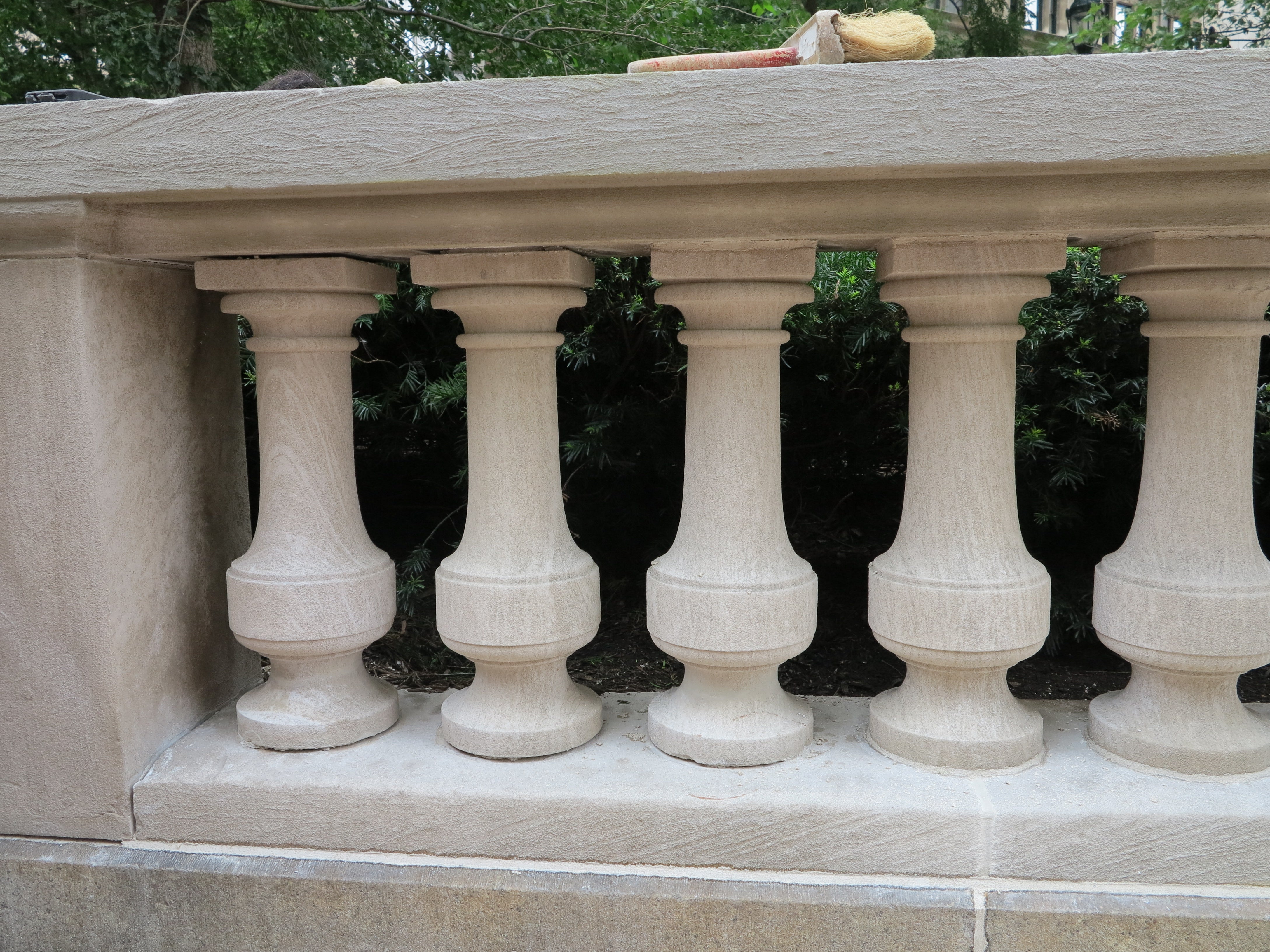 Cleaned, repaired, repinned, and repointed limestone balustrade at Rittenhouse Square's southwest entrance.