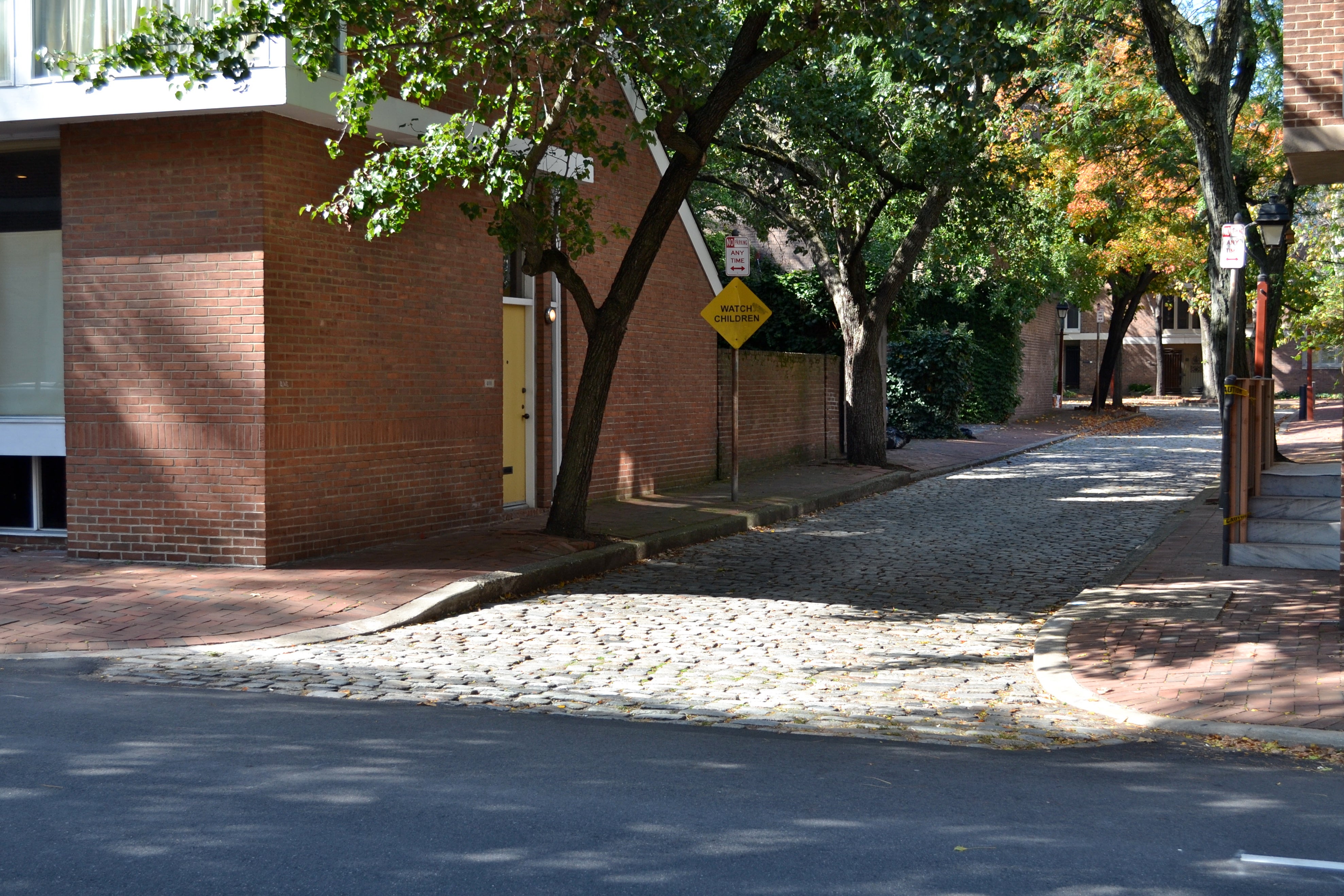 Corners of cobble stone streets are an exception to the ADA ramp requirements because cobble stone is not considered ADA accessible