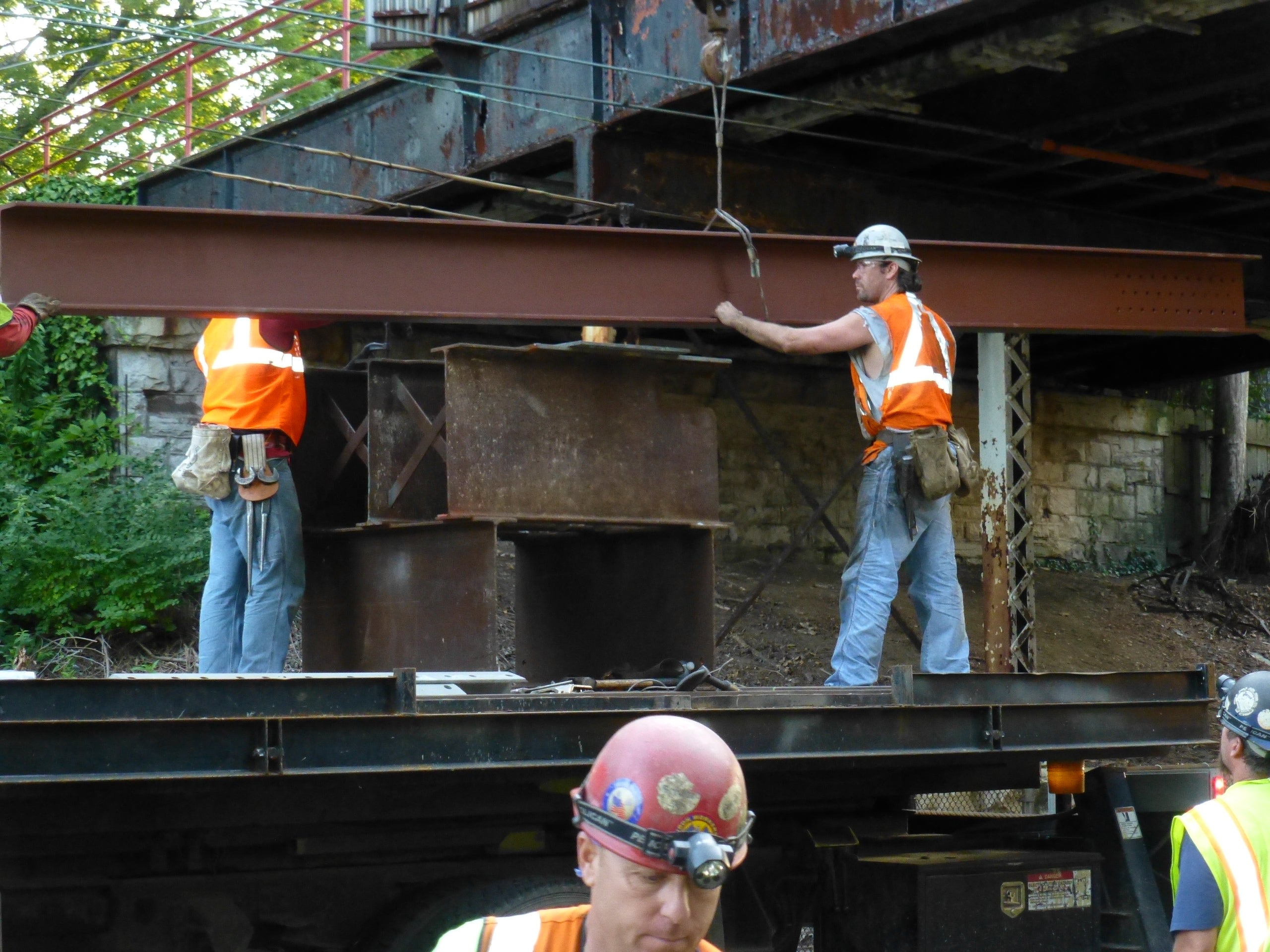 Crews slid eight new beams between existing supports, Photo courtesy of the Streets Department 
