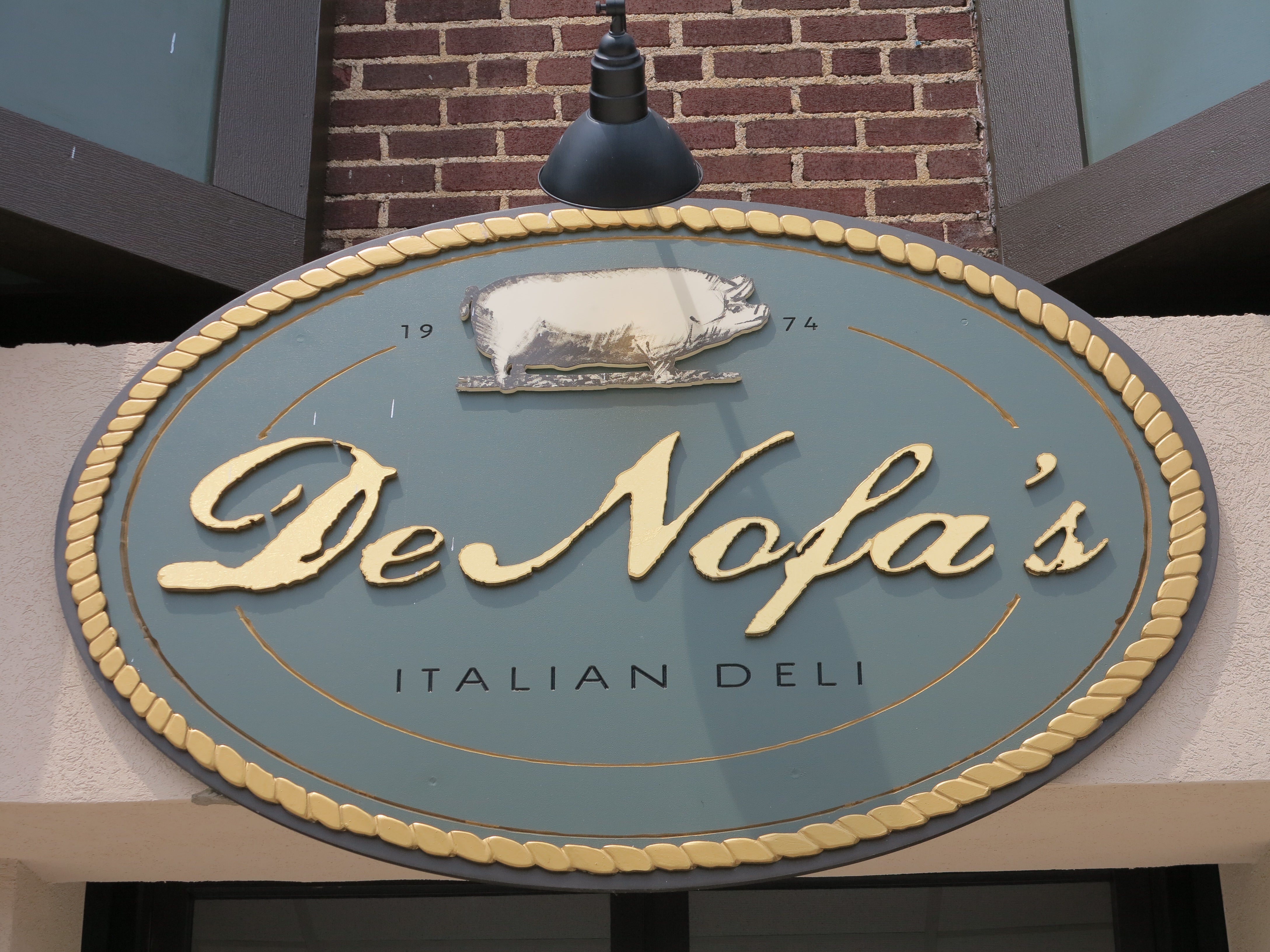 DeNofa's logo graces a new sign above the door