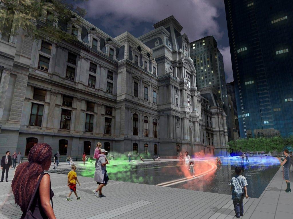 Echelman's fountain at night. The mist, color coordinated with the transit lines, shows subway and trolley movement below. Photo courtesy of Center City District Philadelphia