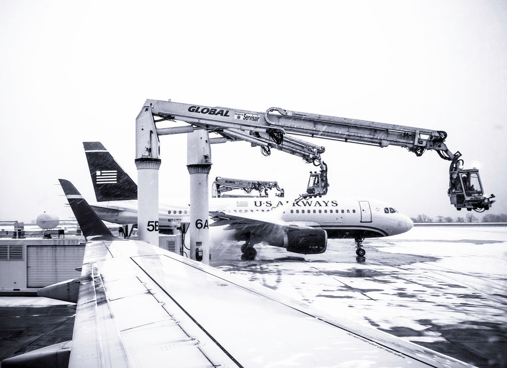 Ice blasters, snowy tarmac, Philadelphia International Airport | Theresa Stigale