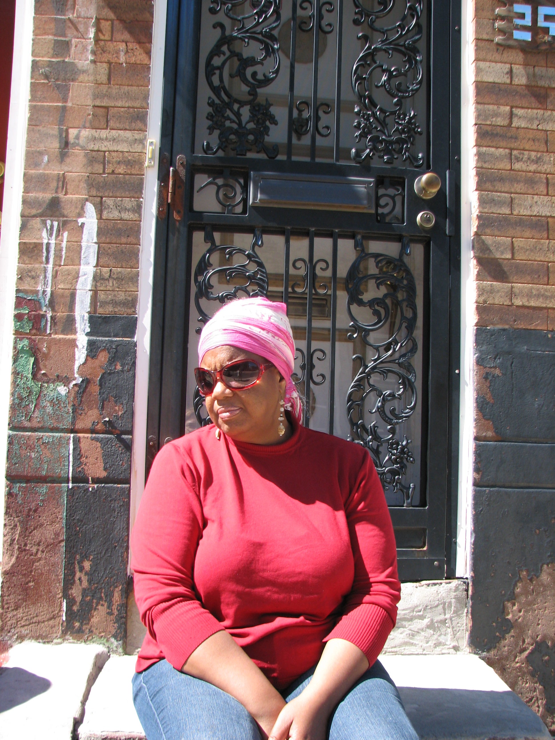 Judith Robinson on the stoop of her childhood home