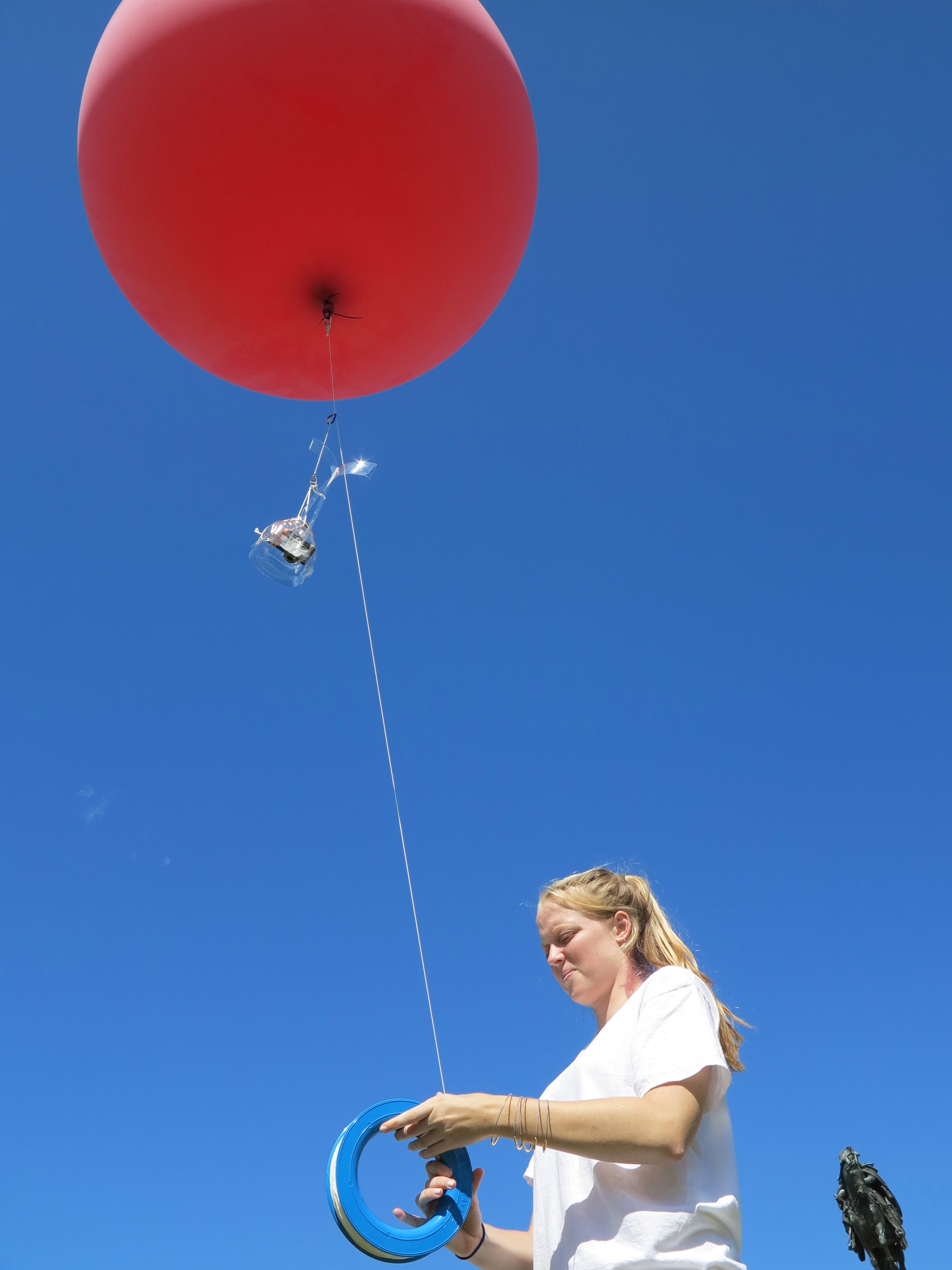 Megan Brock, a Swarthmore student, assists in sending the balloon up for another flight.