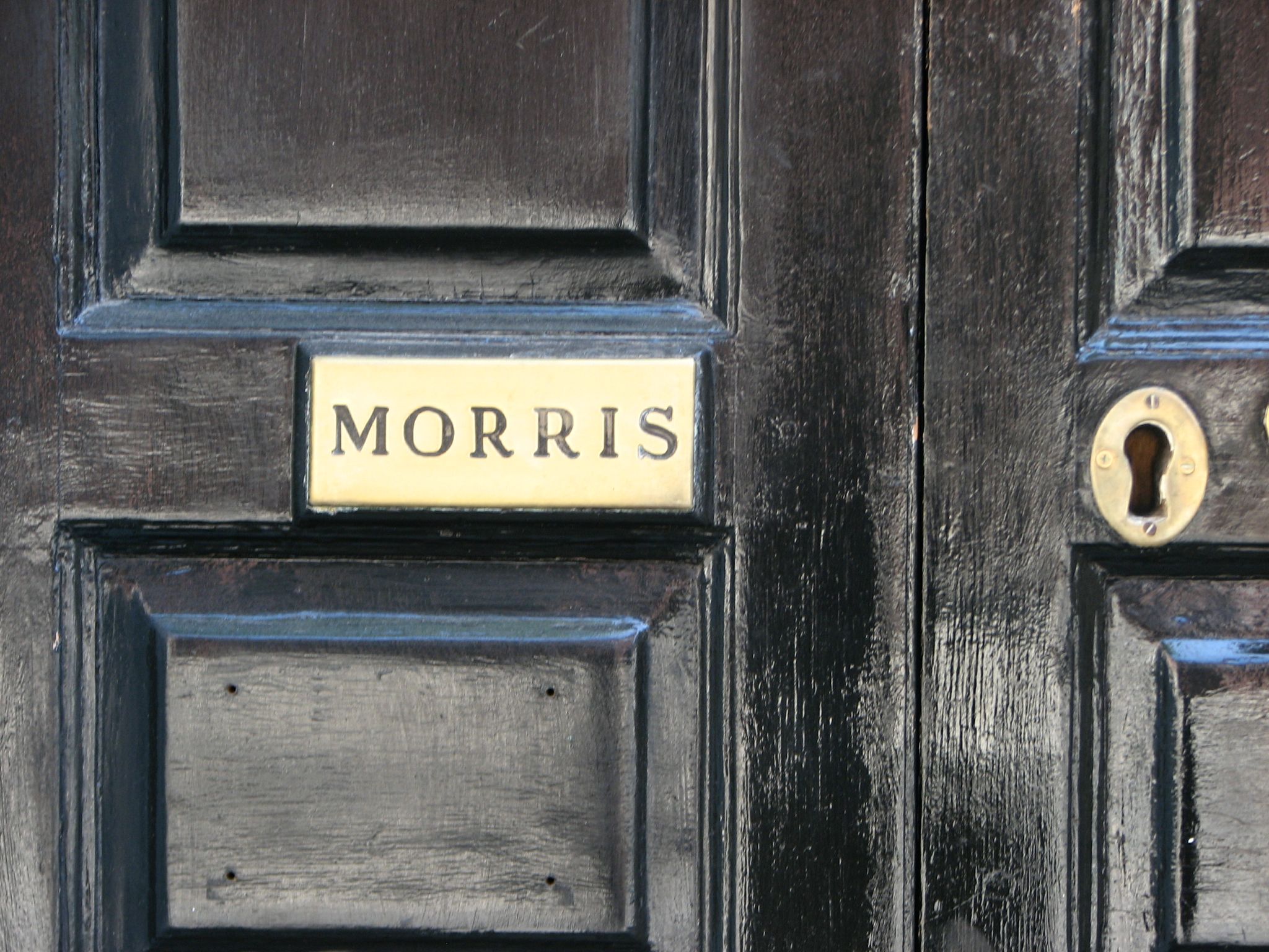 The old brass nameplate on the 8th Street entrance still identifies the great family that once lived there.  