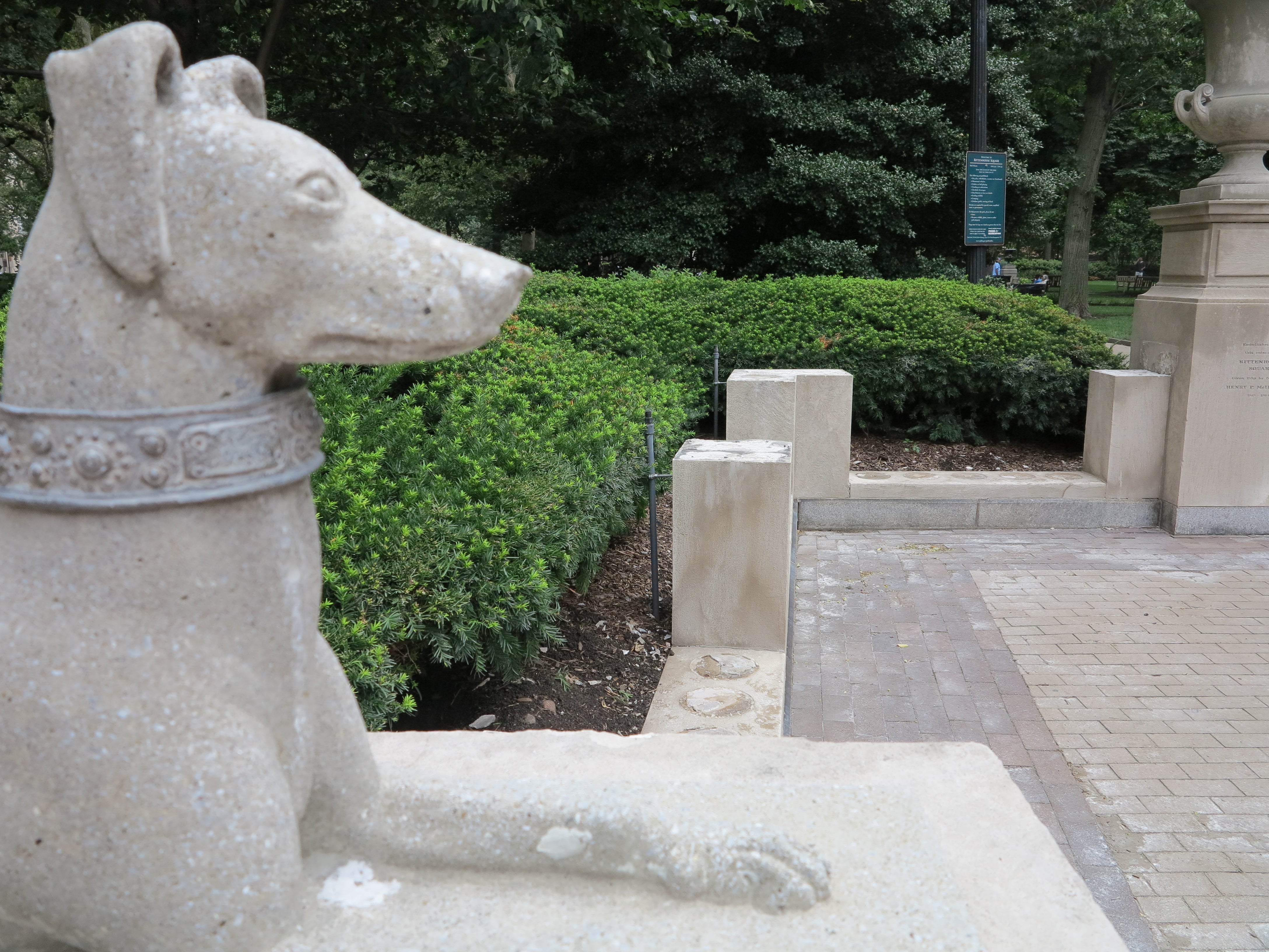 One of the corner entrance's dogs overlooking the missing balustrade.