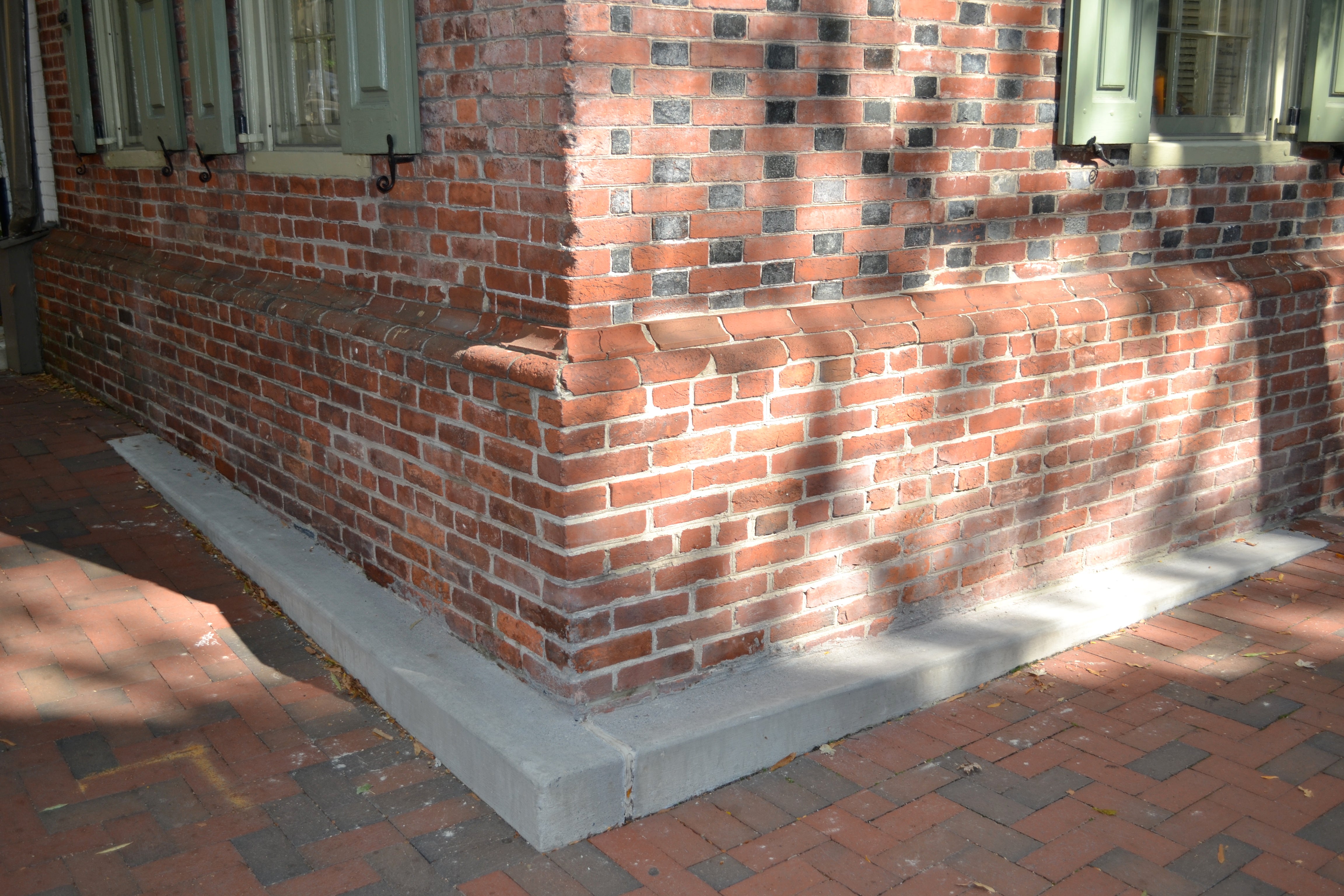 Residents were upset that the cheek wall was made out of concrete and didn't match the brick home or sidewalk