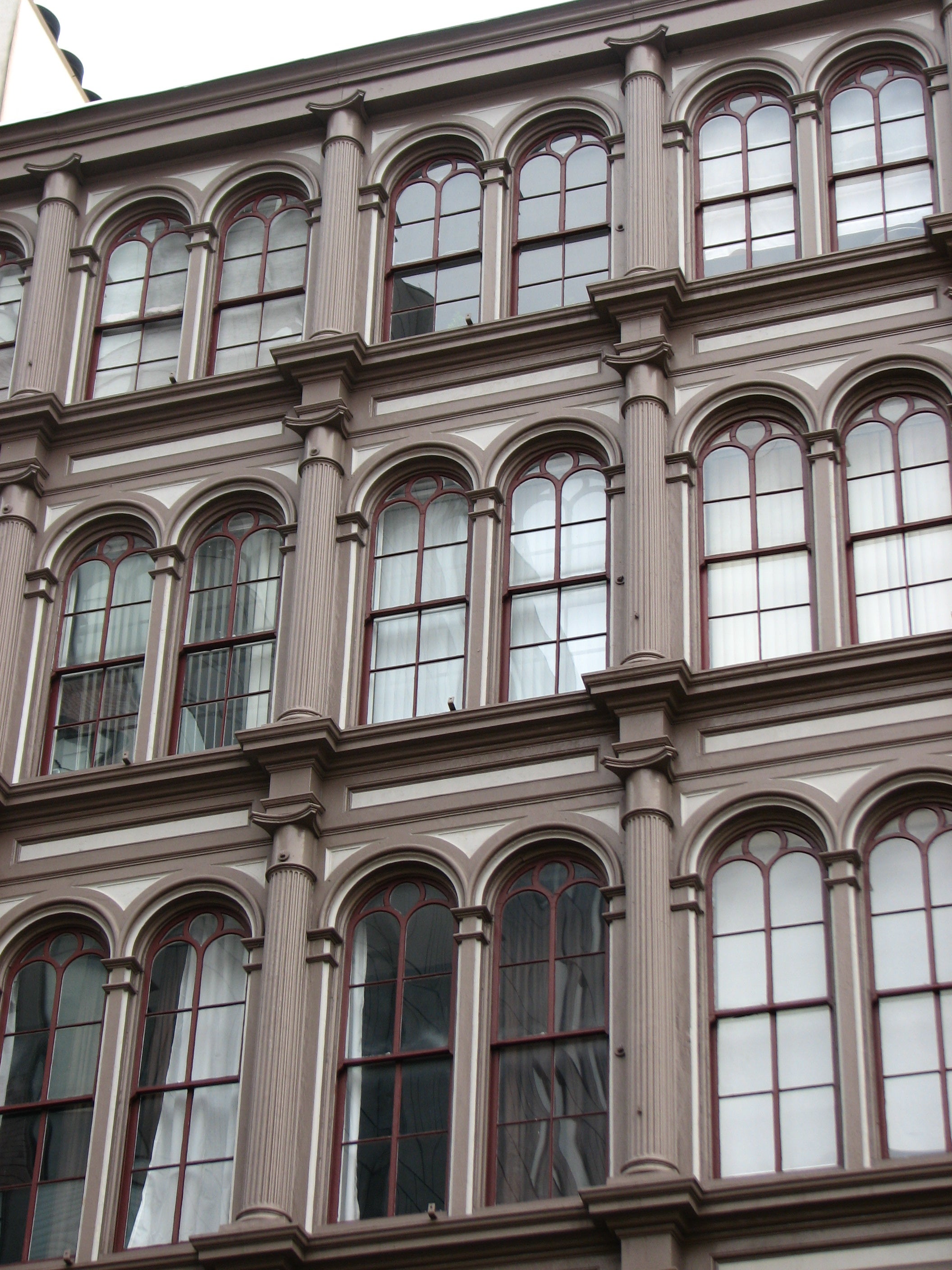 The cornices and columns were designed in raised relief to cast subtle shadows.