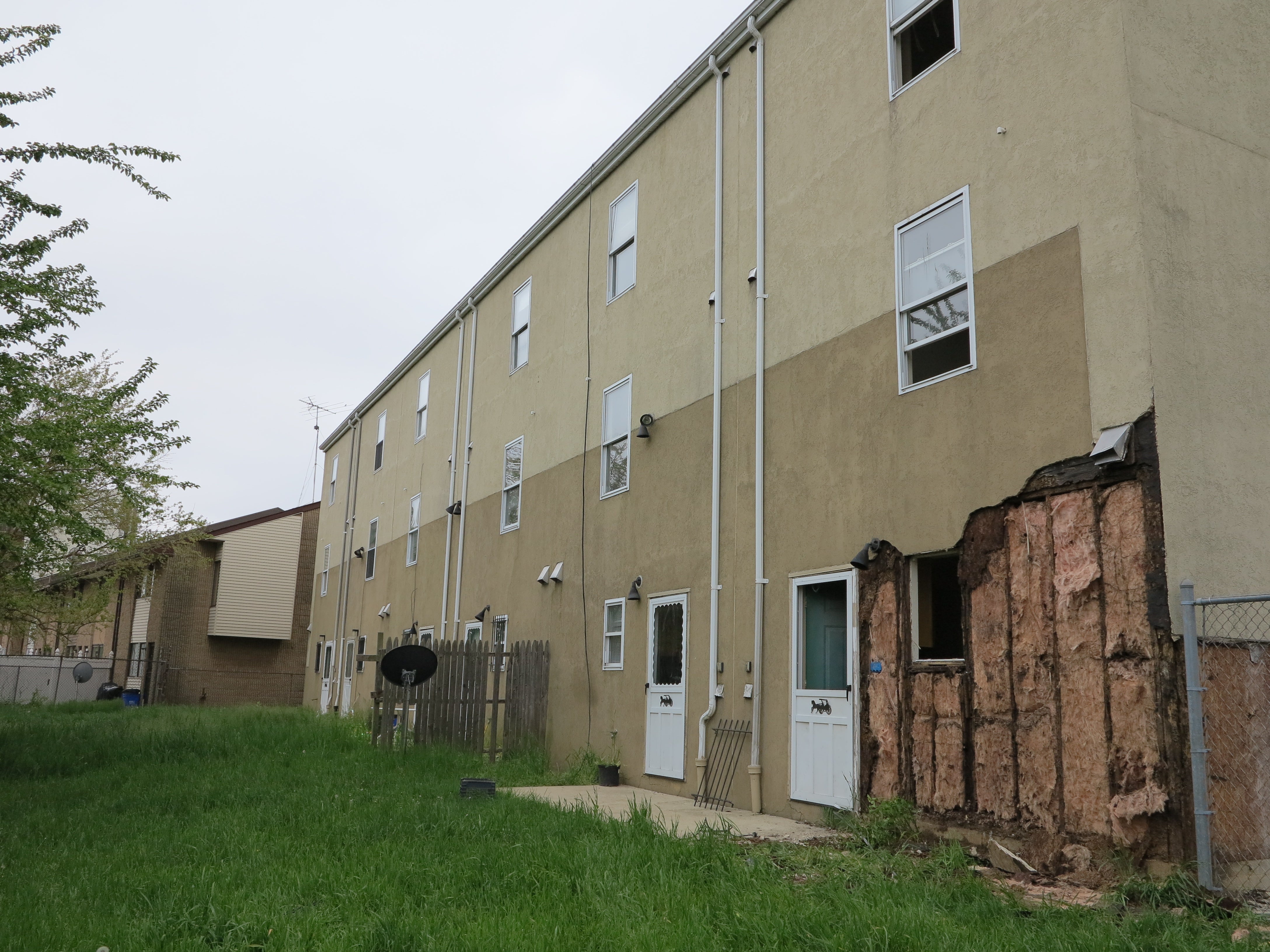 The project included rebuilding the succoed rear facades of Johnnie Tillmon Townhouses at N. 5th and Master streets