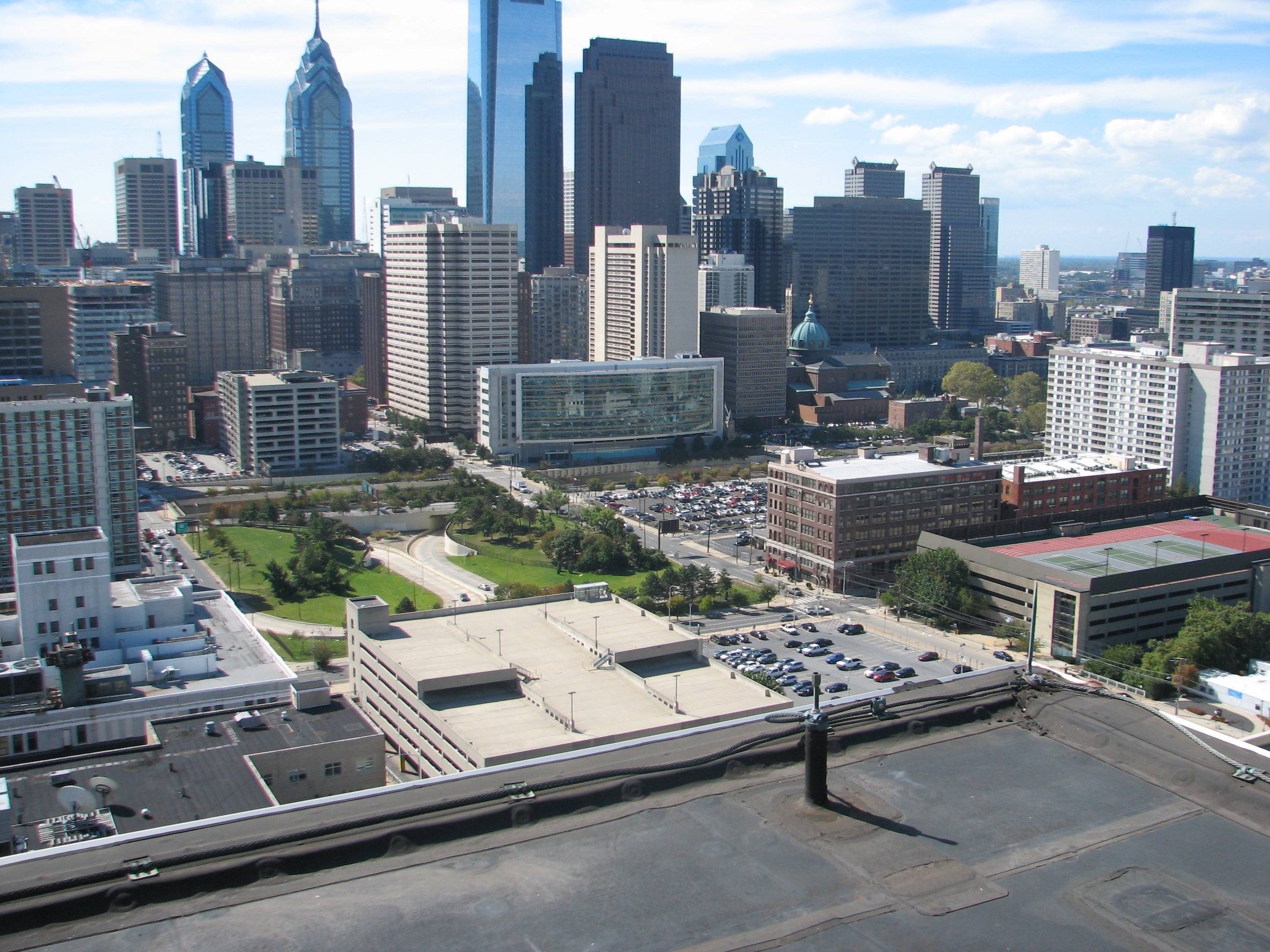 The Provence casino/entertainment development would stretch from Broad Street to 16th, then a pedestrian bridge would take visitors into an existing garage, which occupies the block between 16th and 17th.  This photo shows  the roof of a parking garage that would be demolished - it's the light-colored roof in the lower middle of the photo. The surface lot behind it would also contain a portion of the new building.  The parking garage across 16th street - the one with the red on the roof -  would remain and serve casino/entertainment patrons. It would be connected via pedestrian bridge over 16th street.