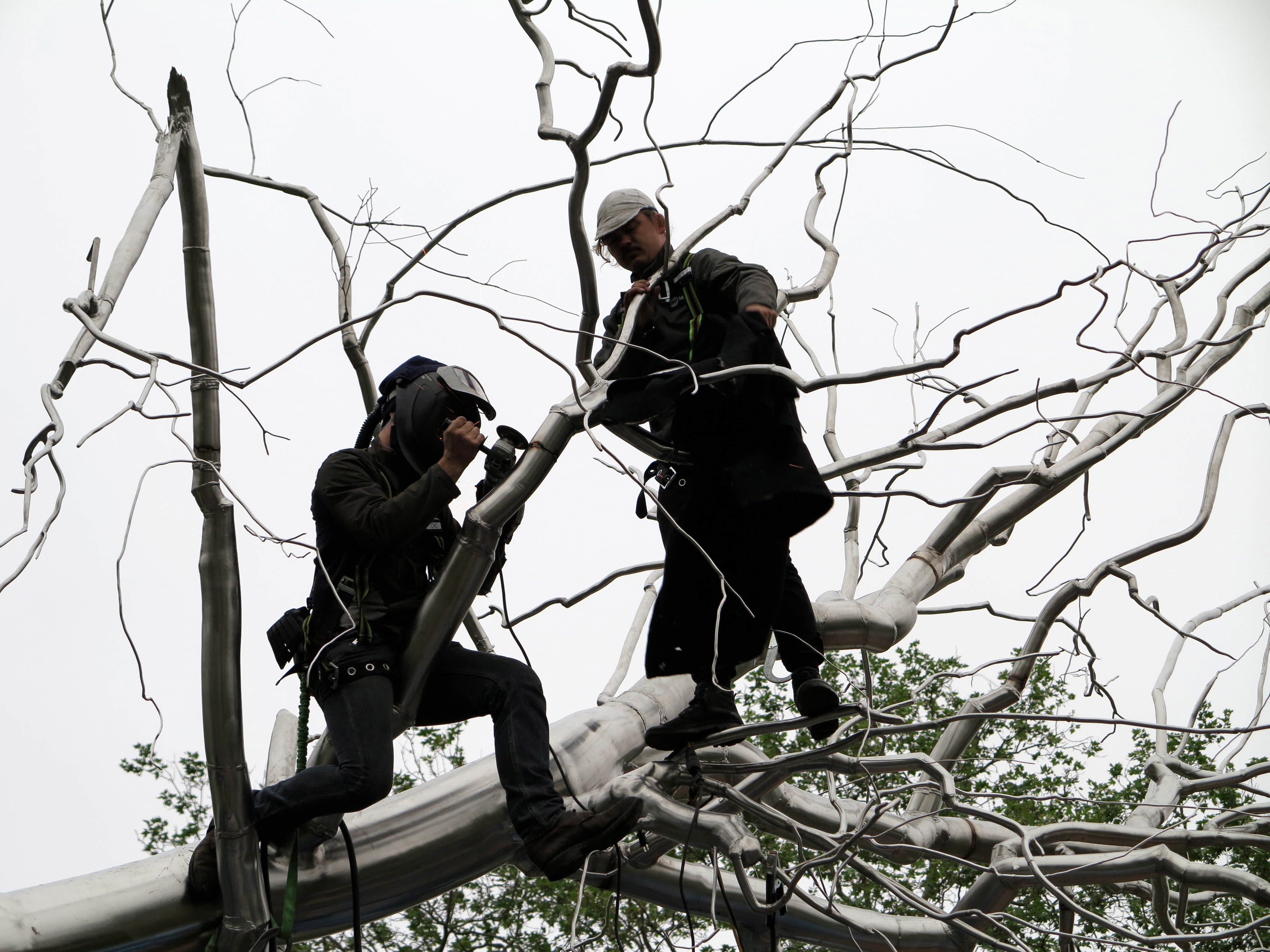 Welders assembling 'Symbiosis', May 2014