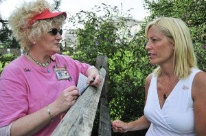 Barbara Buford, Outreach Coordinator for Jeanes Hospital, (l) and Judy Lambert (r), discuss the butterfly release, while Judy wears a butterfly pin in memory of her daughter, Katie Elise Lambert.