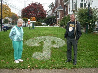 Jack and Betty Vogler are amused by the graffiti on their lawn. Photo courtesy of KYW.