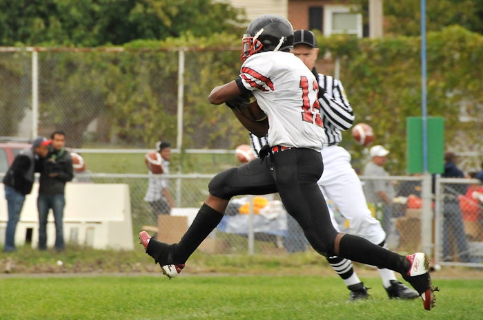 After his pass reception, Northeast's #12 strides into the end zone with the form of a hurdler or long jumper. His halfback pass for the two point conversion was incomplete.