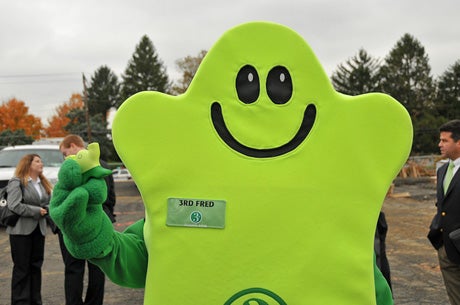 3rd Fred proudly holds up what may appear to be his tiny son or daughter in his right hand, but in truth it's just a spongy hand exerciser. 3rd Fred was the most green of all the ceremony's at