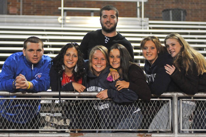 On a bundle up night when the Phillies were playing in the fourth game of the World Series, some folks, like these Washington High friends, still came out to cheer for and support their  school'