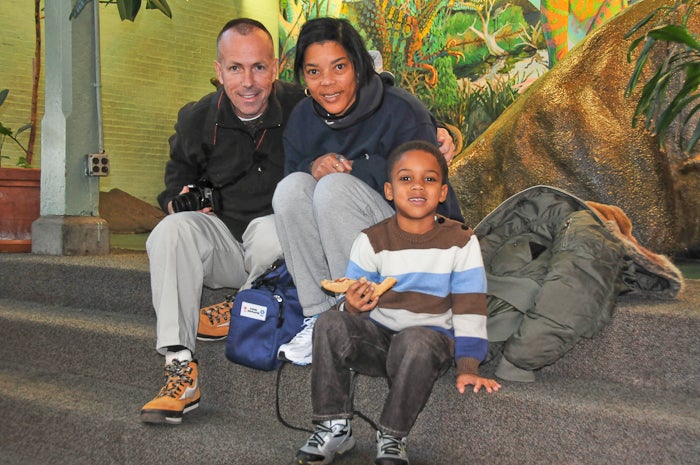 Steve Brennan and his wife Shirley, both long-time Philadelphia Zoo members, brought their 5- year-old grandson, Reece Henry, to see Santa and enjoy the festivities--after he finishes his sandwich of 