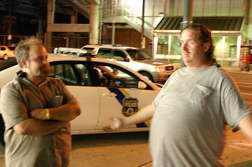 Phil Pappas, left, and Mike Mawson, of West Frankford Town Watch, outside the Thriftway at Frankford Avenue and Pratt Street around 2 a.m. Sat. July 10.