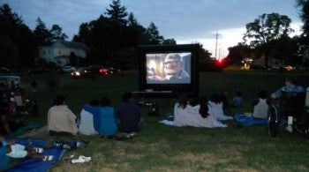 Families gather to watch a viewing of Disney's Up at Seven Mile Road Church's free Community Party. Photo supplied by Seven Mile Road Church.