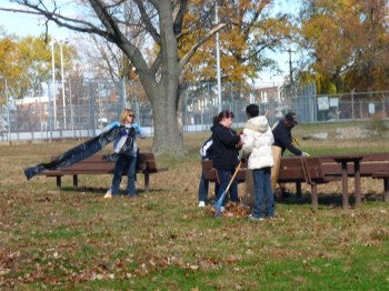 Volunteers help clean the Grove at Lawncrest Rec Center to prepare for the annual Veterans Day celebration