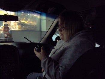 Sharon Weiseman of Tacony Town Watch make sure the radio signal is working so she can connect to the base operator.