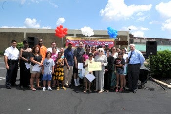 Essay contest winners and their parents celebrate with Mayor Michael Nutter and GNPCC President Al Taubenberger. Photo courtesy of Rising Sun Plaza.