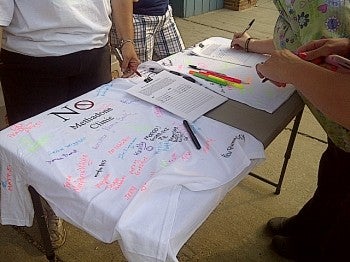 People lined up outside Guppies Childcare Center Tuesday to sign petitions and T-shirts in opposition of a methadone clinic on the 7900-block of Frankford Avenue.