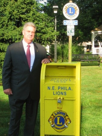 Northeast Lion Rich Wilson at the eyeglass drop off box located in Lions Park, Fox Chase