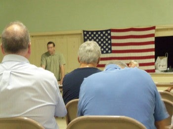 Tacony Civic Association board member Lou Iatarola reviews zoning matters at the September 2011 meeting.