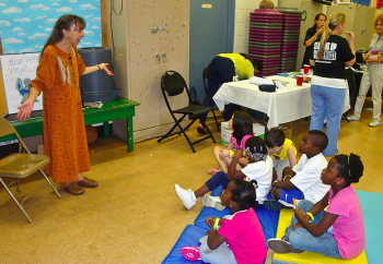 Michele Belluomini tells a story to children at the Northeast Celebration. Photo by George Mai Michele Belluomini tells a story to children at the Northeast Celebration. Photo by George Mai